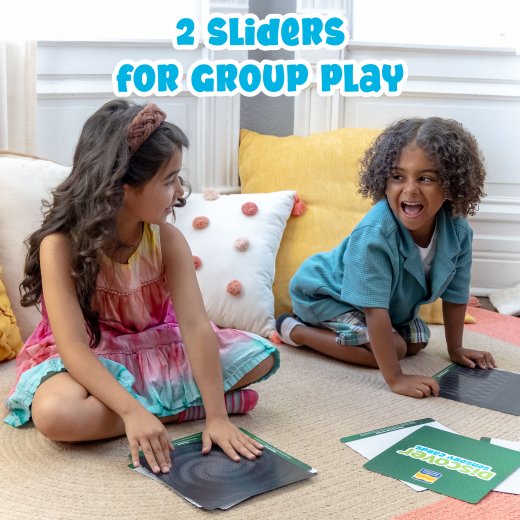 Two children playing with sliders on a carpeted floor.