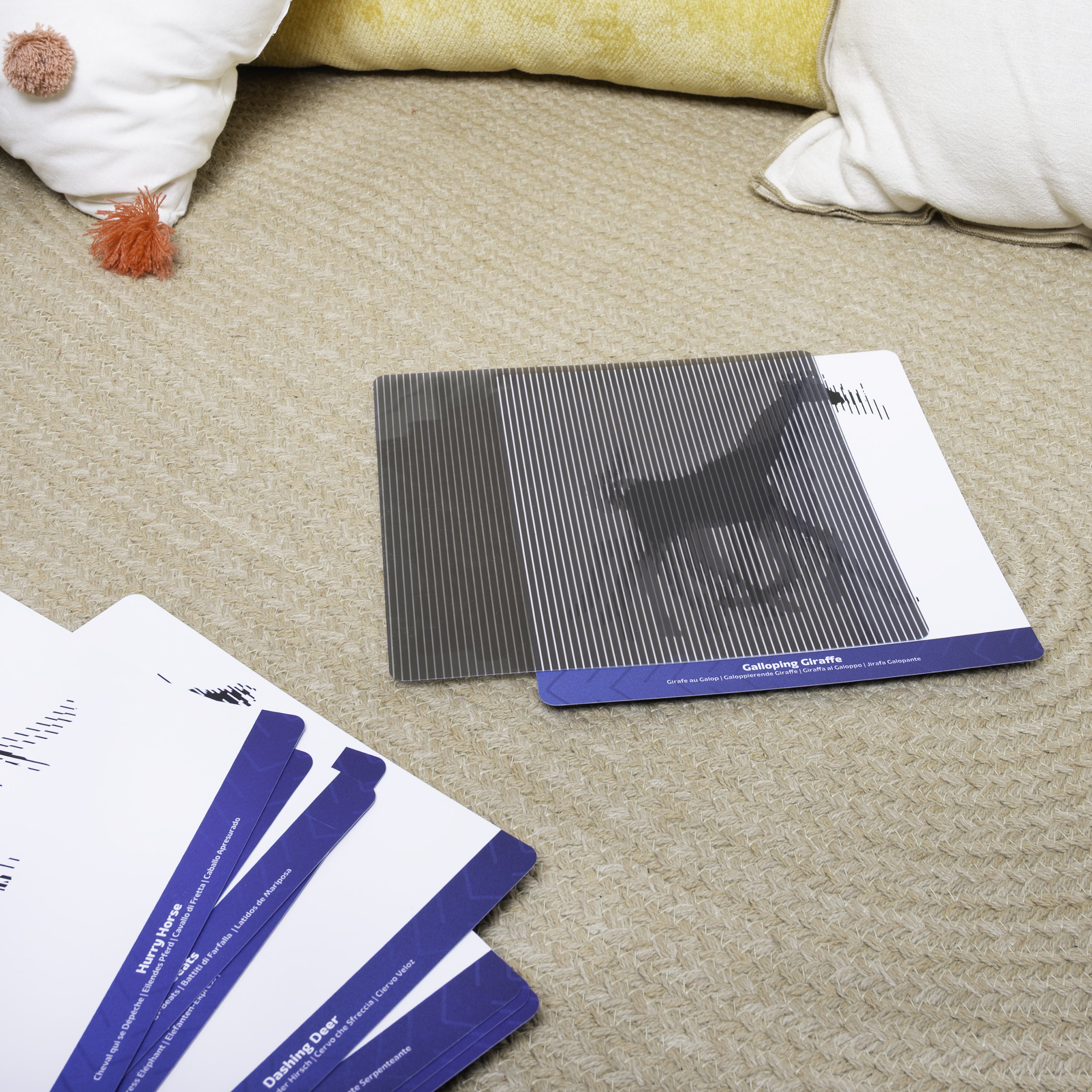 Giraffe in motion card on beige rug