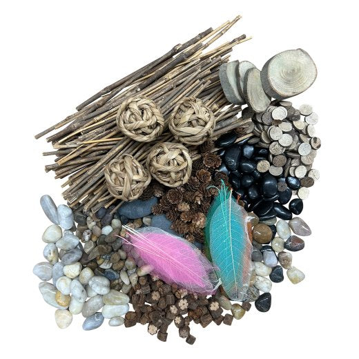 Assorted natural materials including sticks, stones, and feathers on a white background