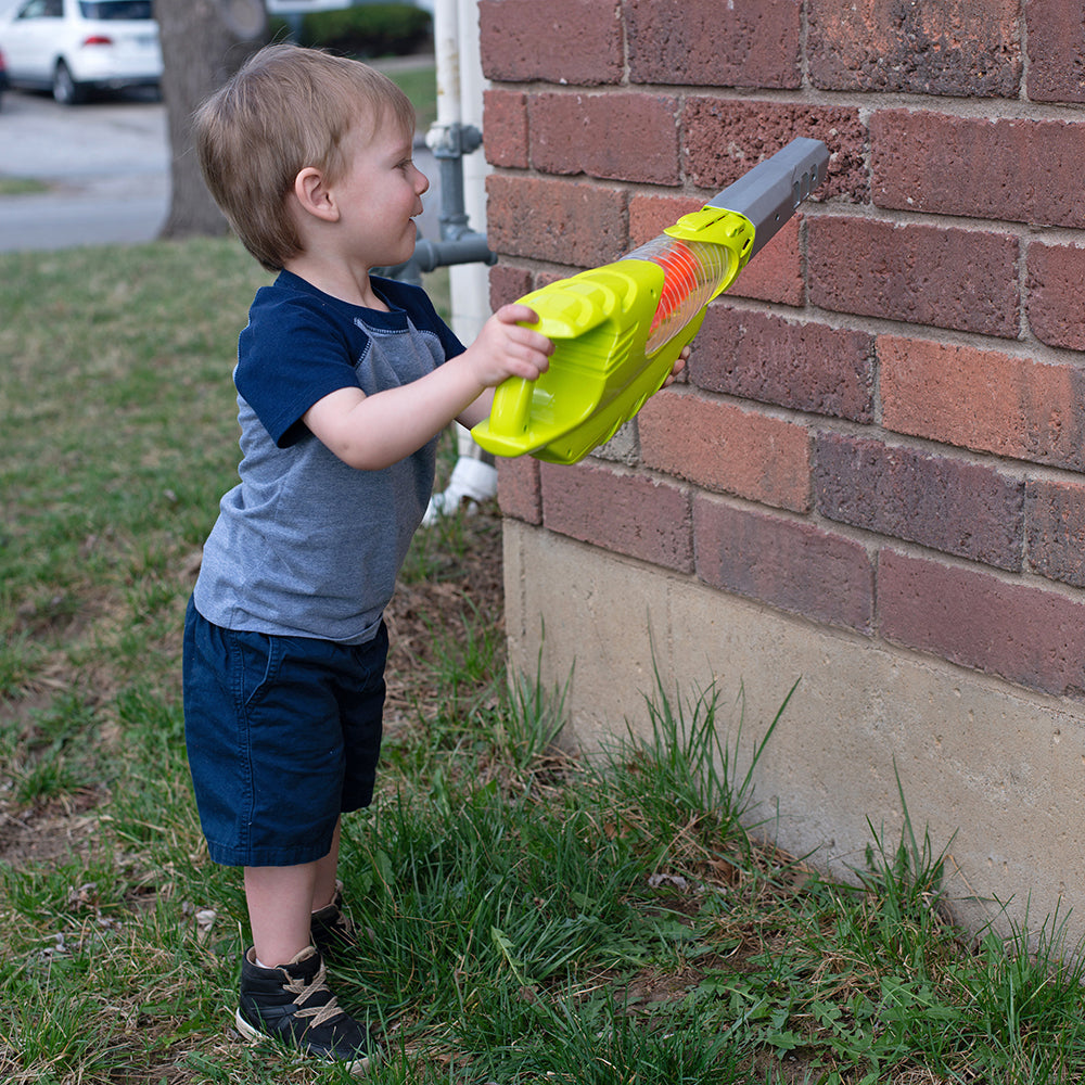 Toddler Playing with Leaf Blower