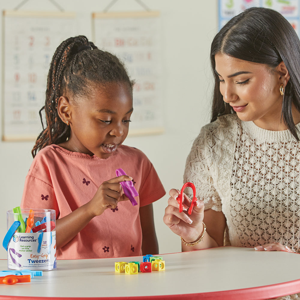 Teacher Showing Kid How to Use Easy Grip Tweezers