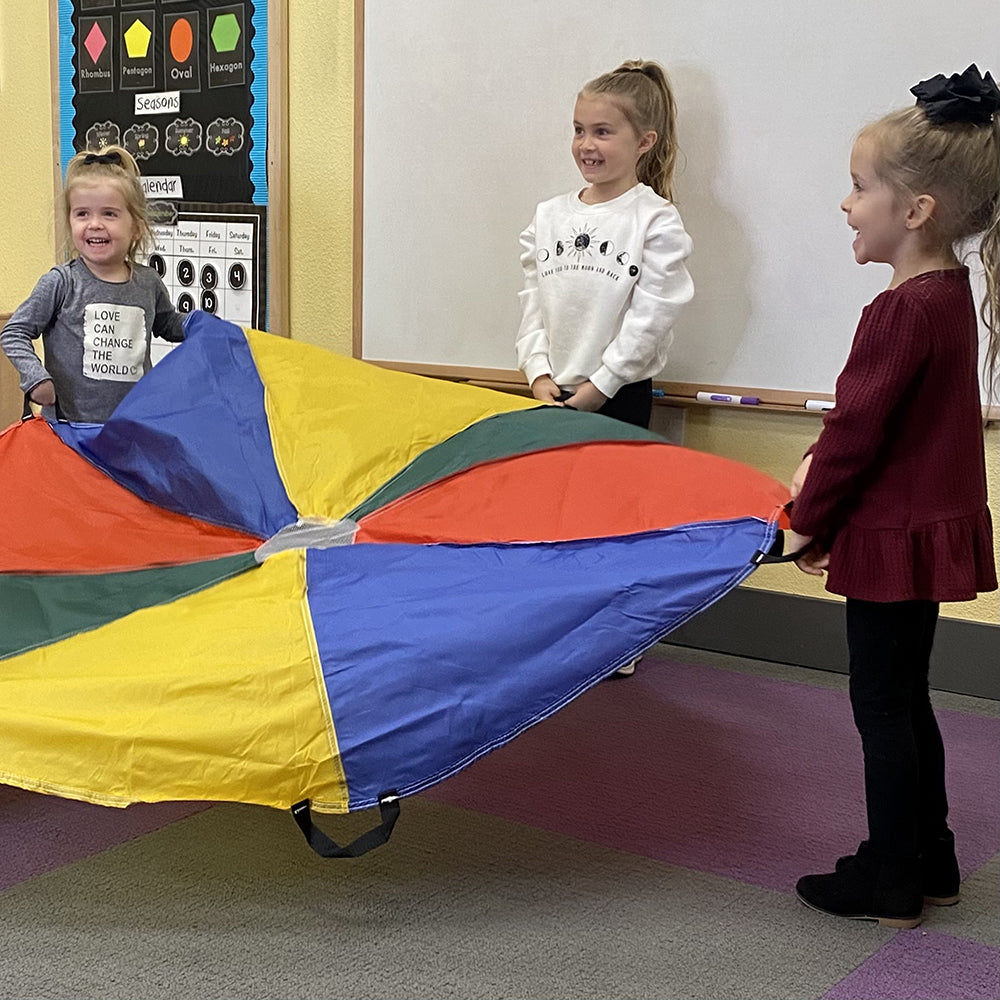 Three Kids in Classroom with Play Parachute