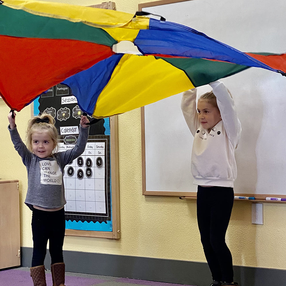 Two Kids Demonstrating How to Use Play Parachute