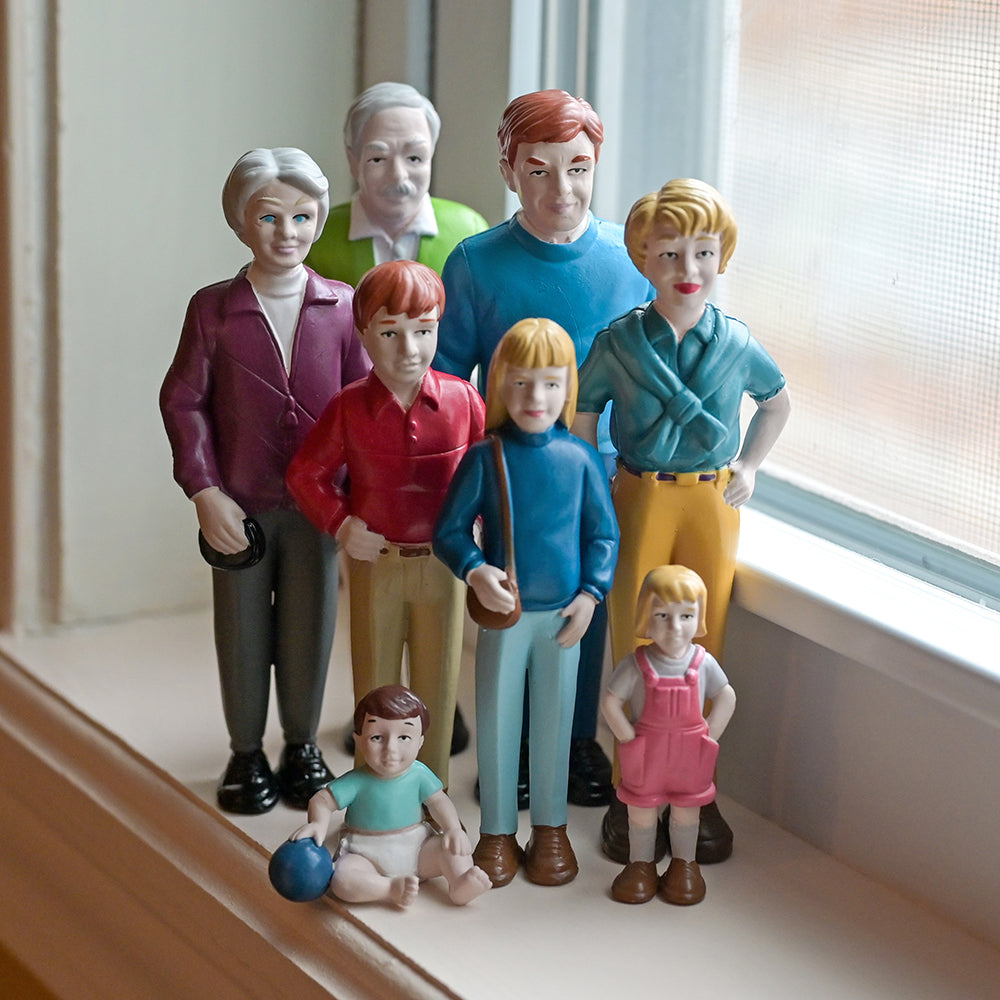 8 Piece Set of Caucasian Family Figurines on Windowsill
