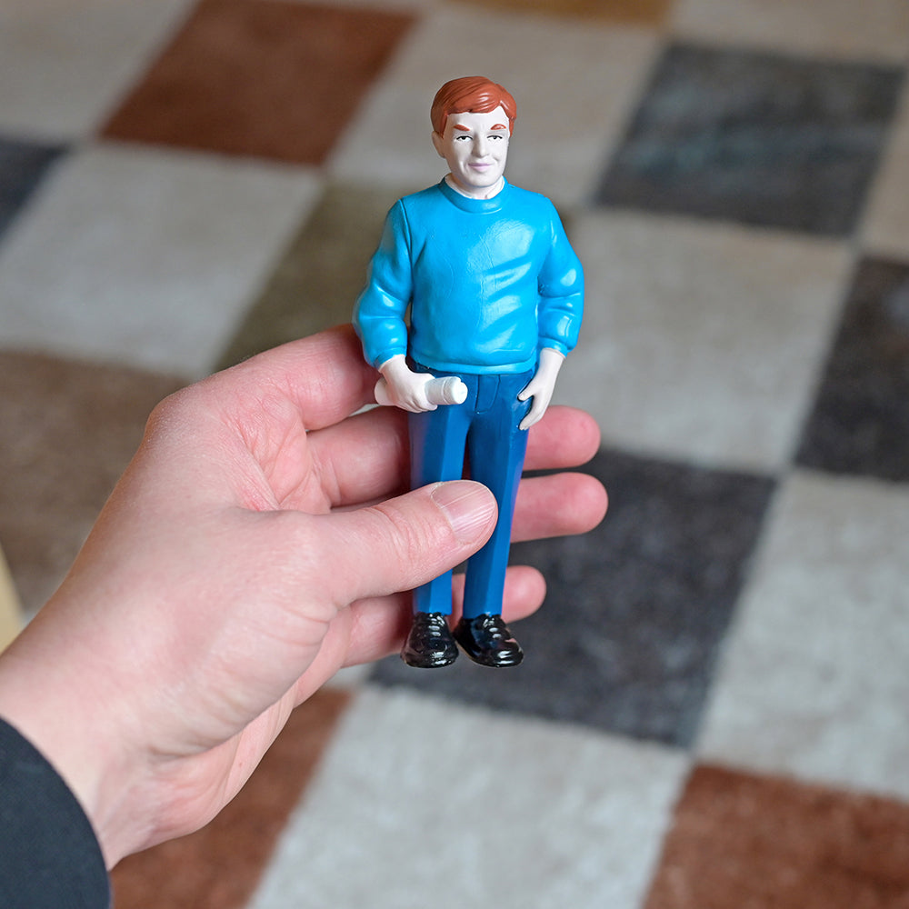 Caucasian Dad Figure in Teacher's hand