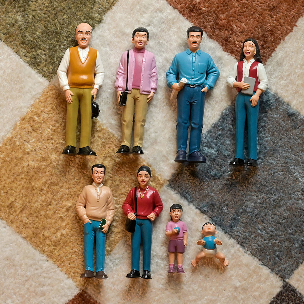 Family of Hispanic Figures Laid Out on Carpet