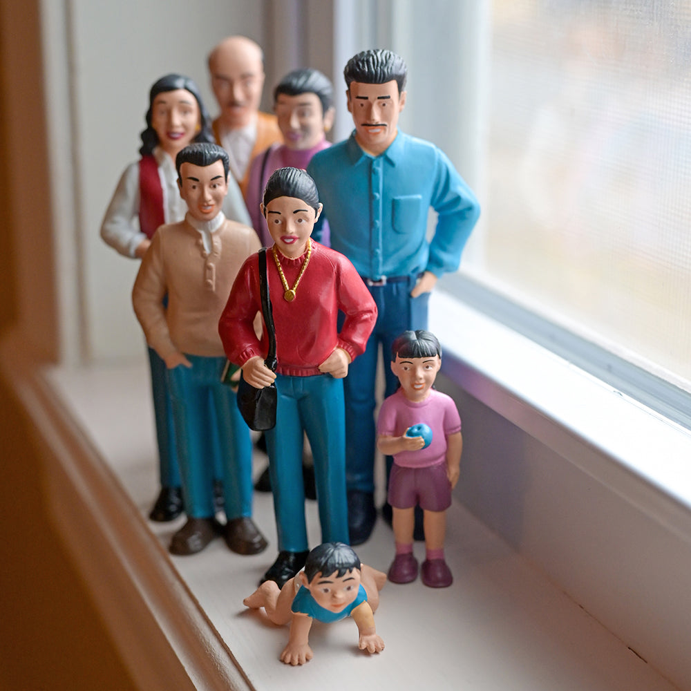 Hispanic Family Figures on Windowsill