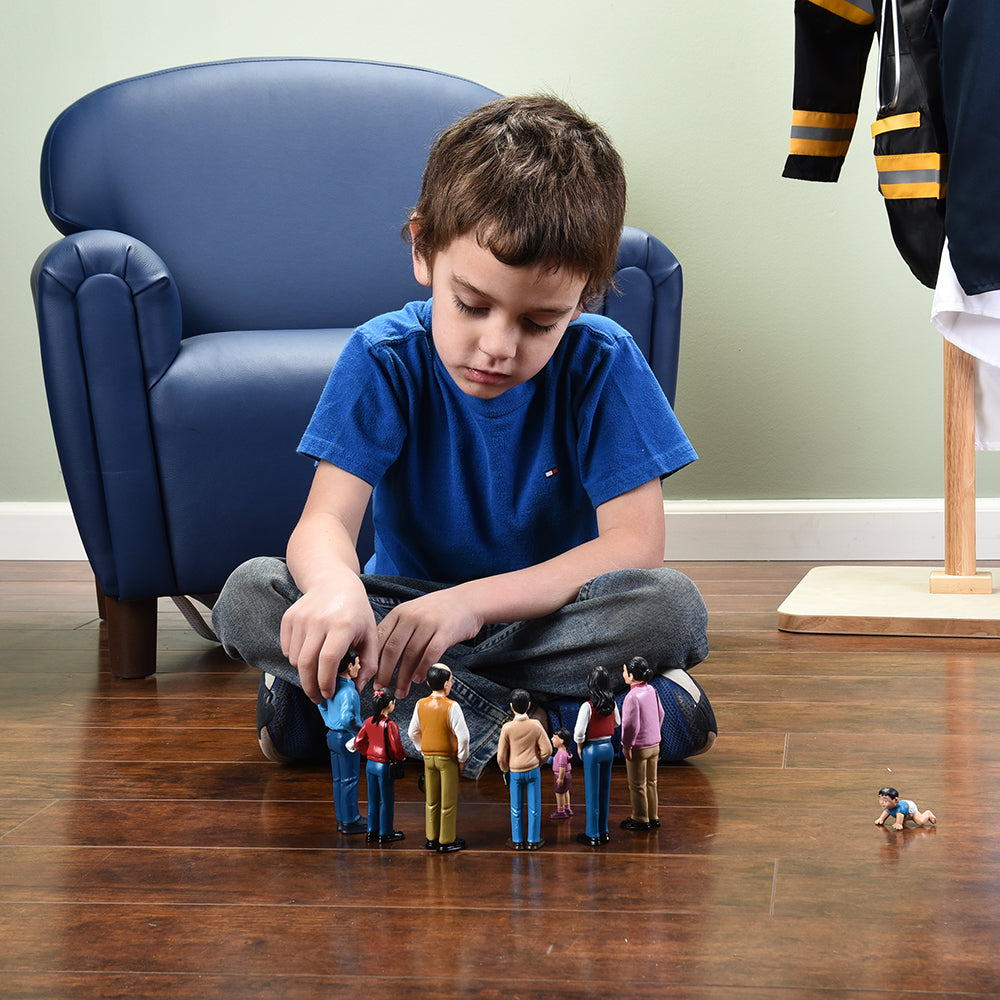 Kid Playing With Hispanic Family Figures