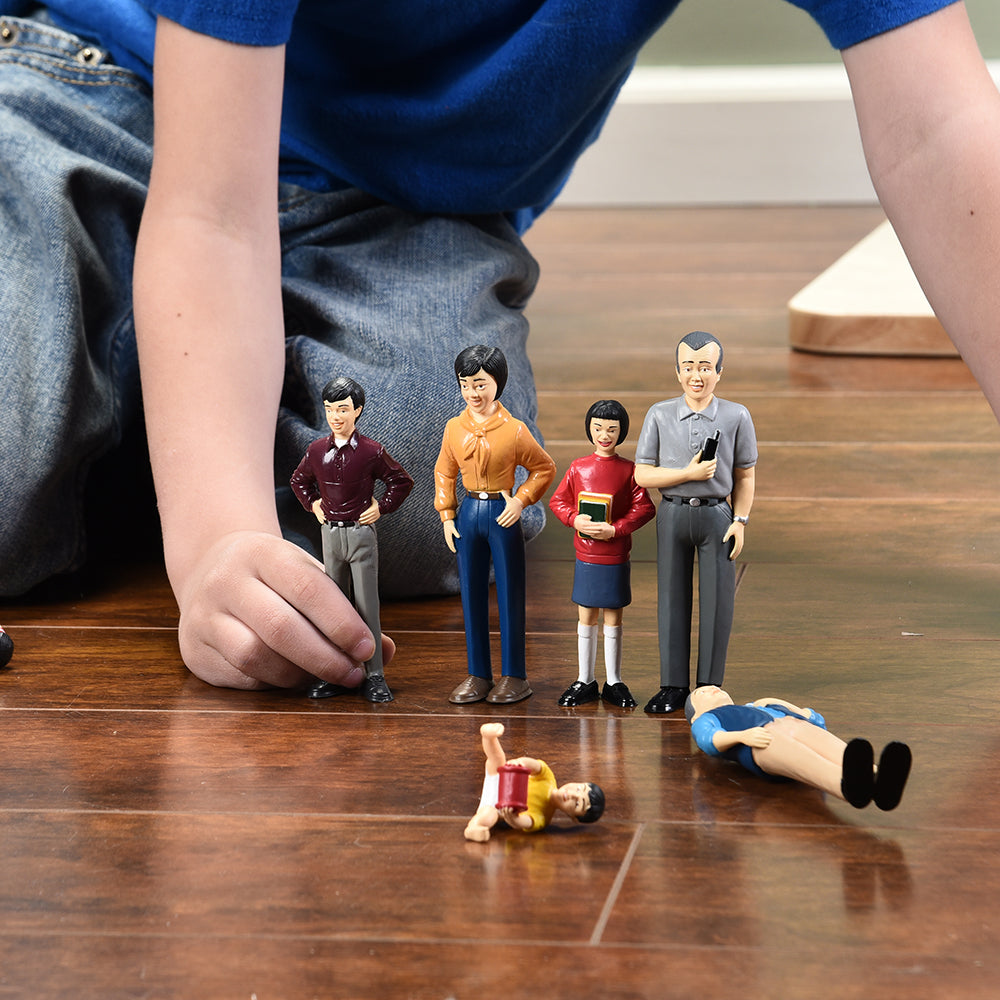 Kid Playing with Asian Vinyl Figurines