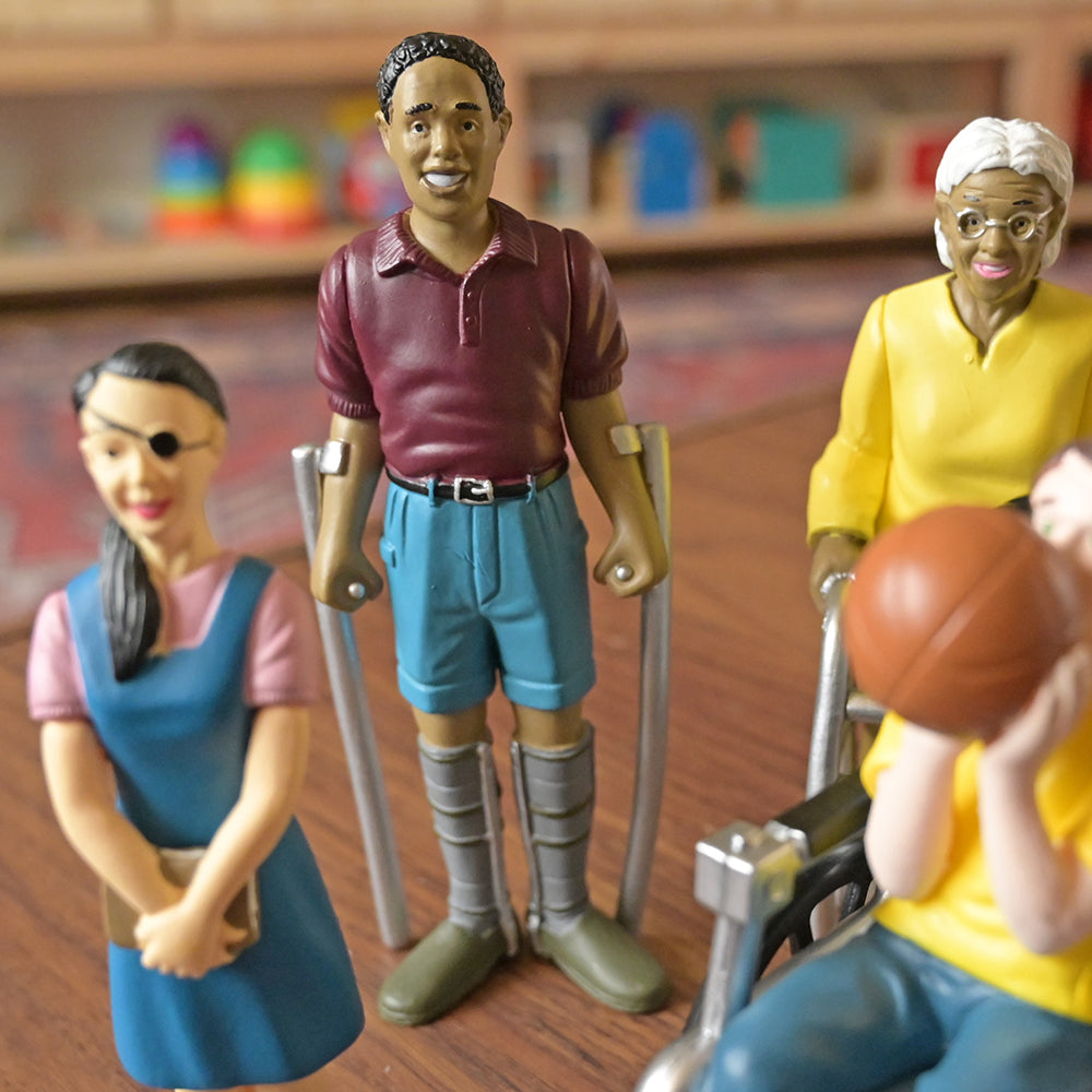 Close-up of Inclusive Friends with Diverse Abilities Vinyl Figure Set