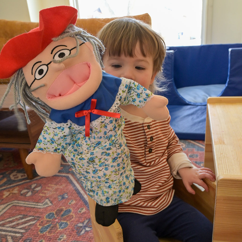 Toddler Interacting with There Was an Old Lady Storytelling Puppet