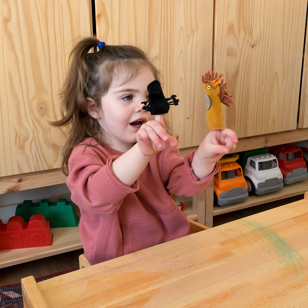 Toddler Interacting with There Was an Old Lady Storytelling Props Set