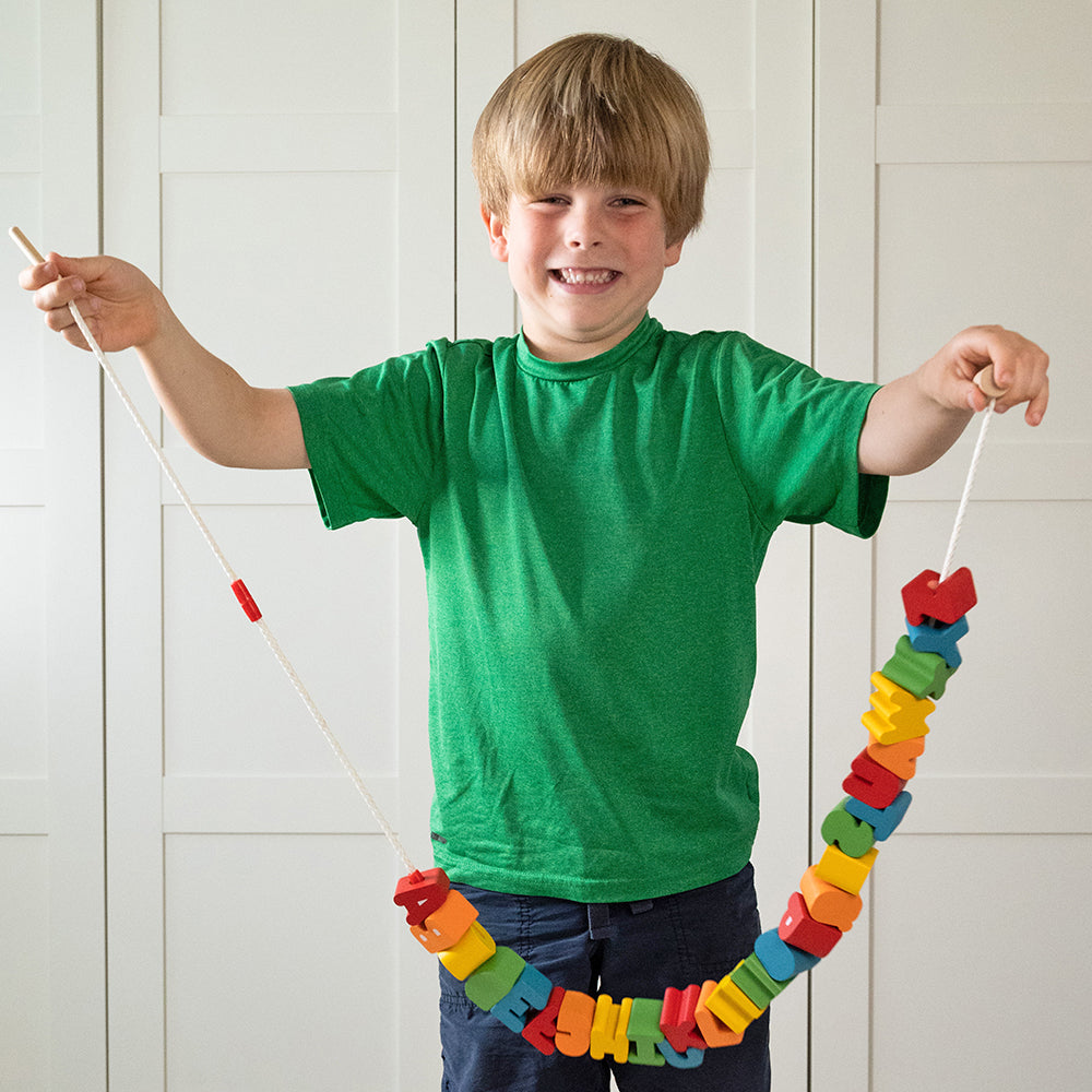 Kid Holding Lacing letters on 35 inch Safety Cord