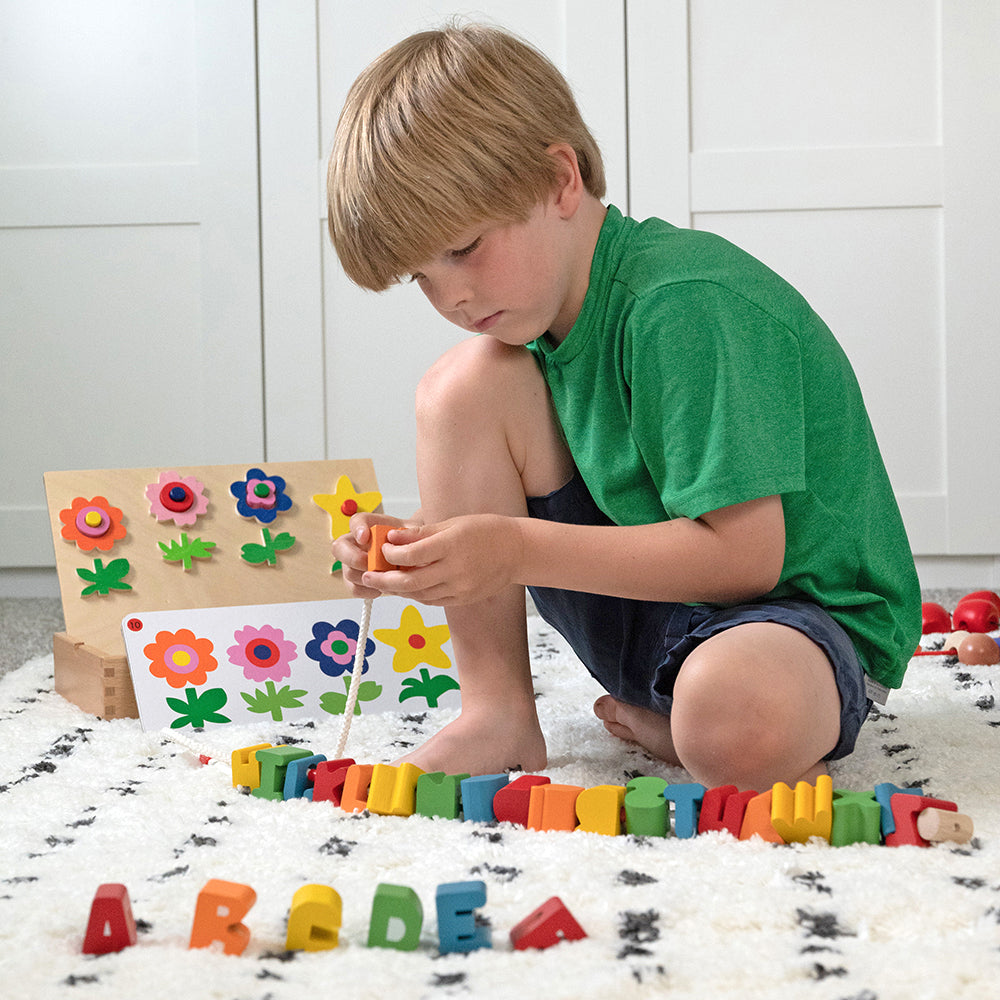 Kid Engaging with Jumbo Wooden Alphabet Lacing Beads Set
