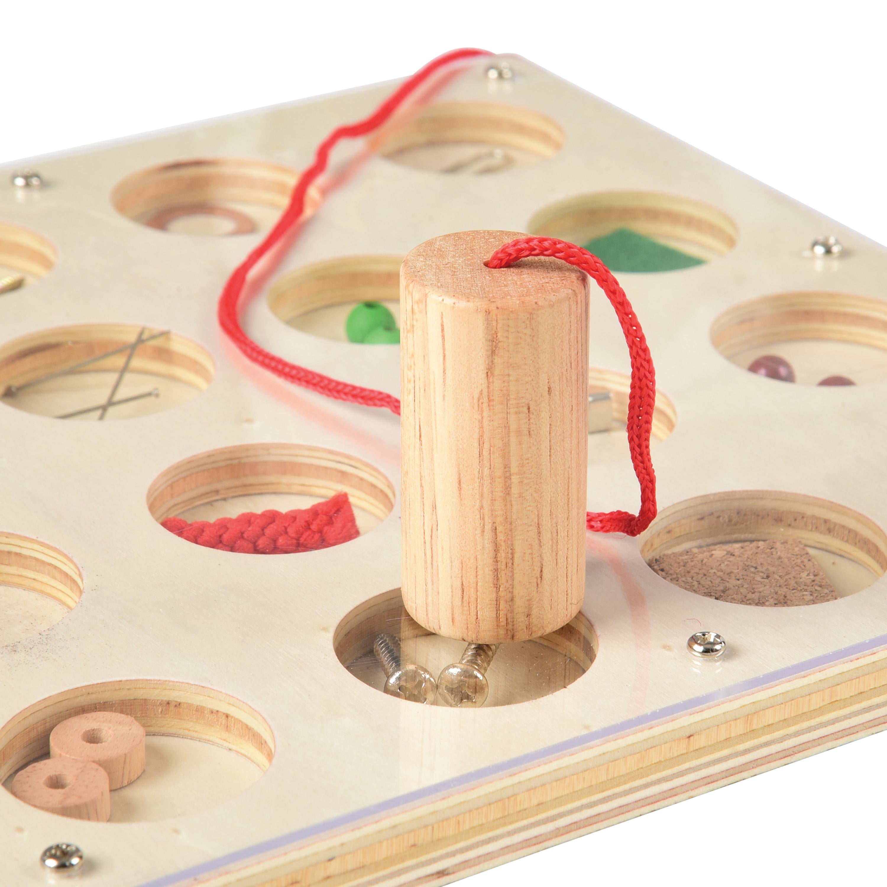 Wooden puzzle with cylindrical wooden block and red string on a white background