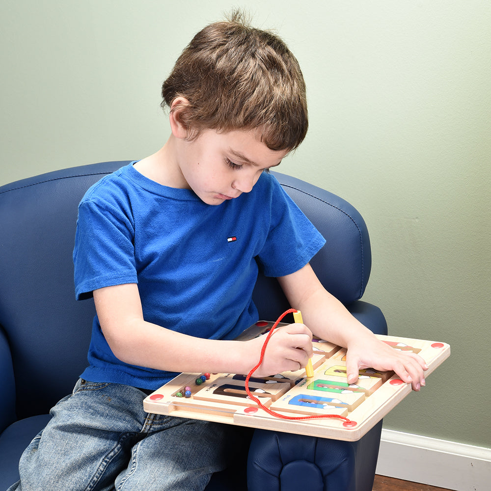 Kid Using Magnetic Color Matching Game