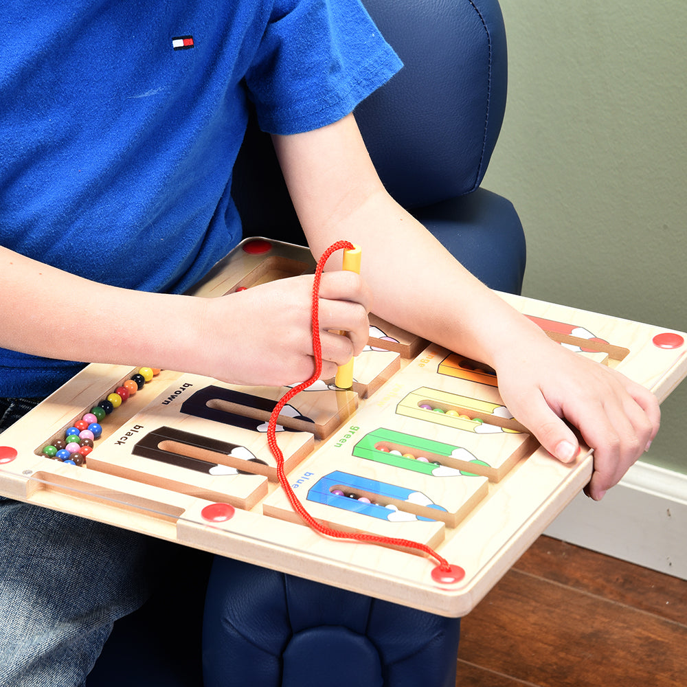 Close-up of Kid Using Magnetic Color Matching Game