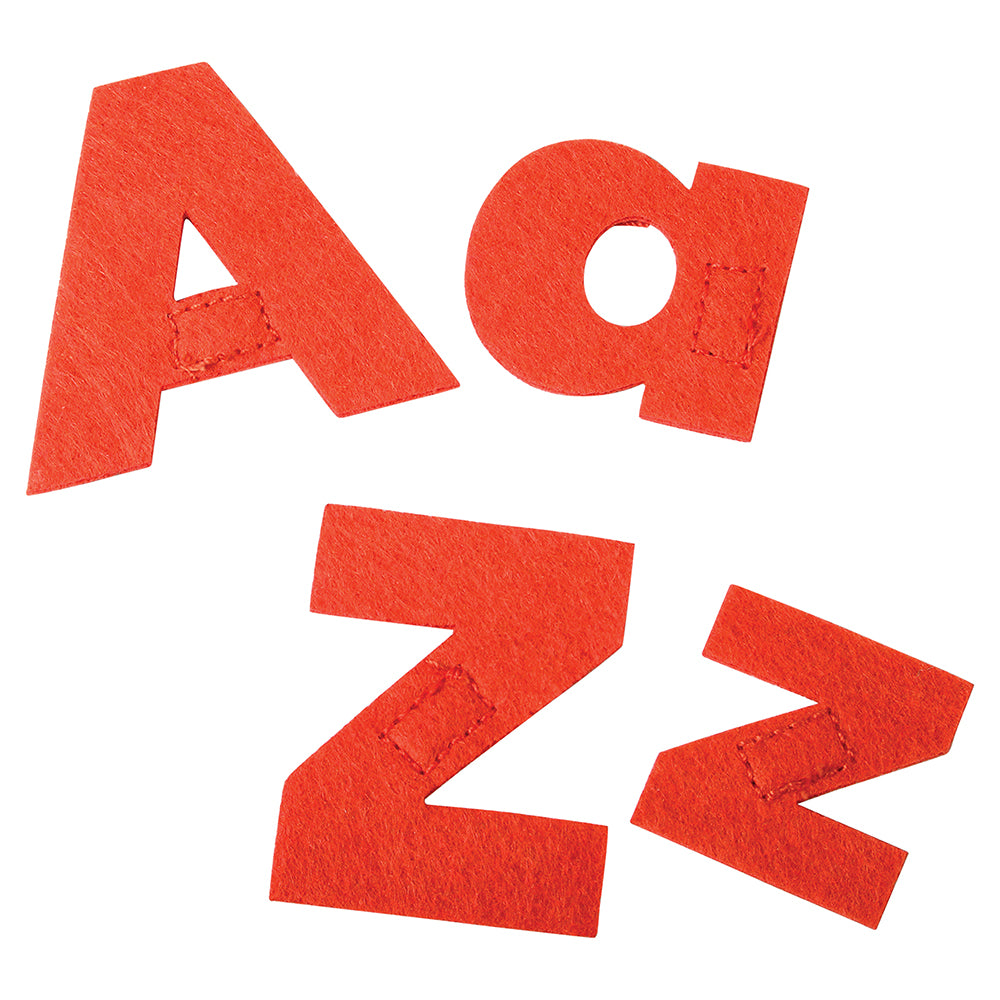 Close-up of fabric letters on a white background