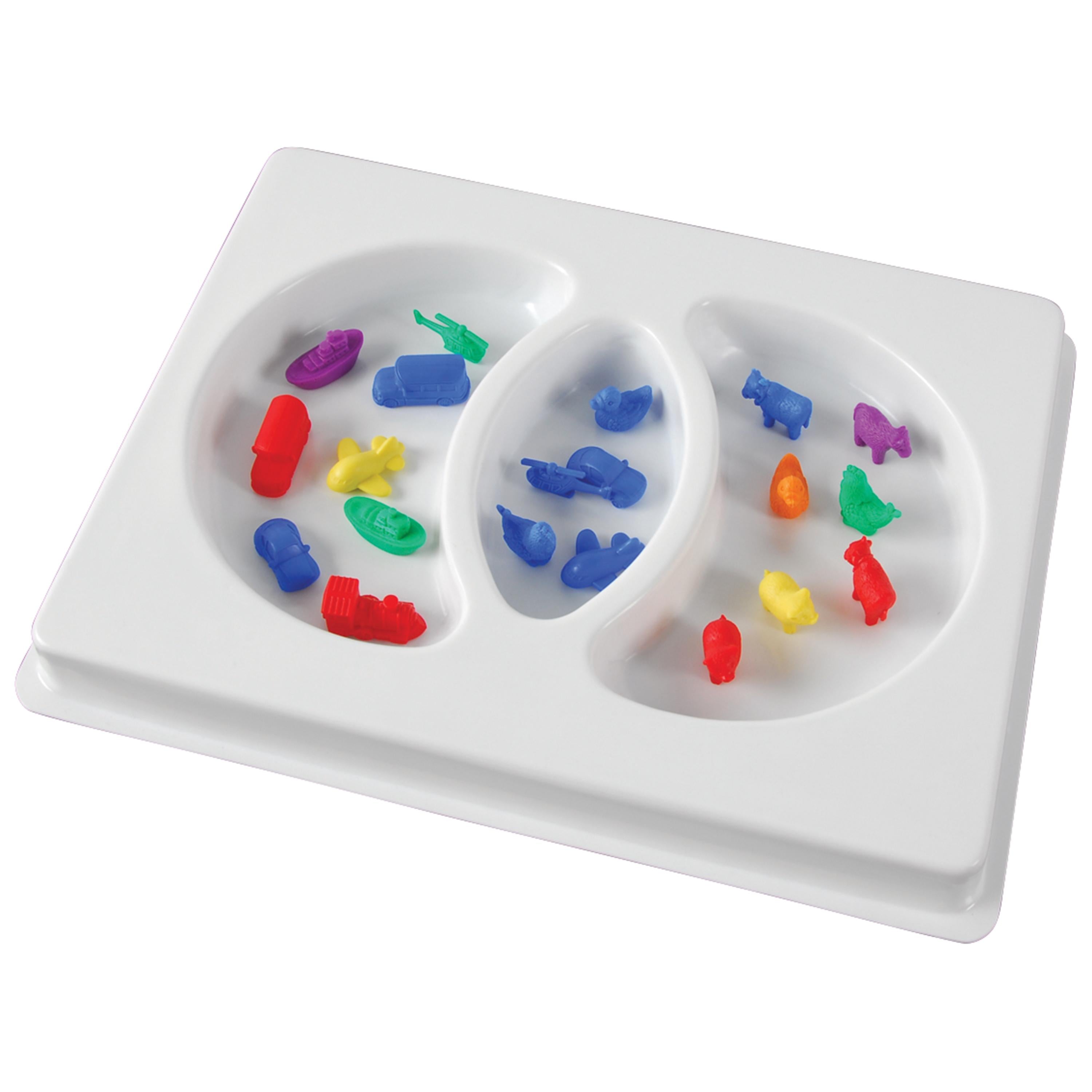 White plastic sorting tray with colorful figures on a white background