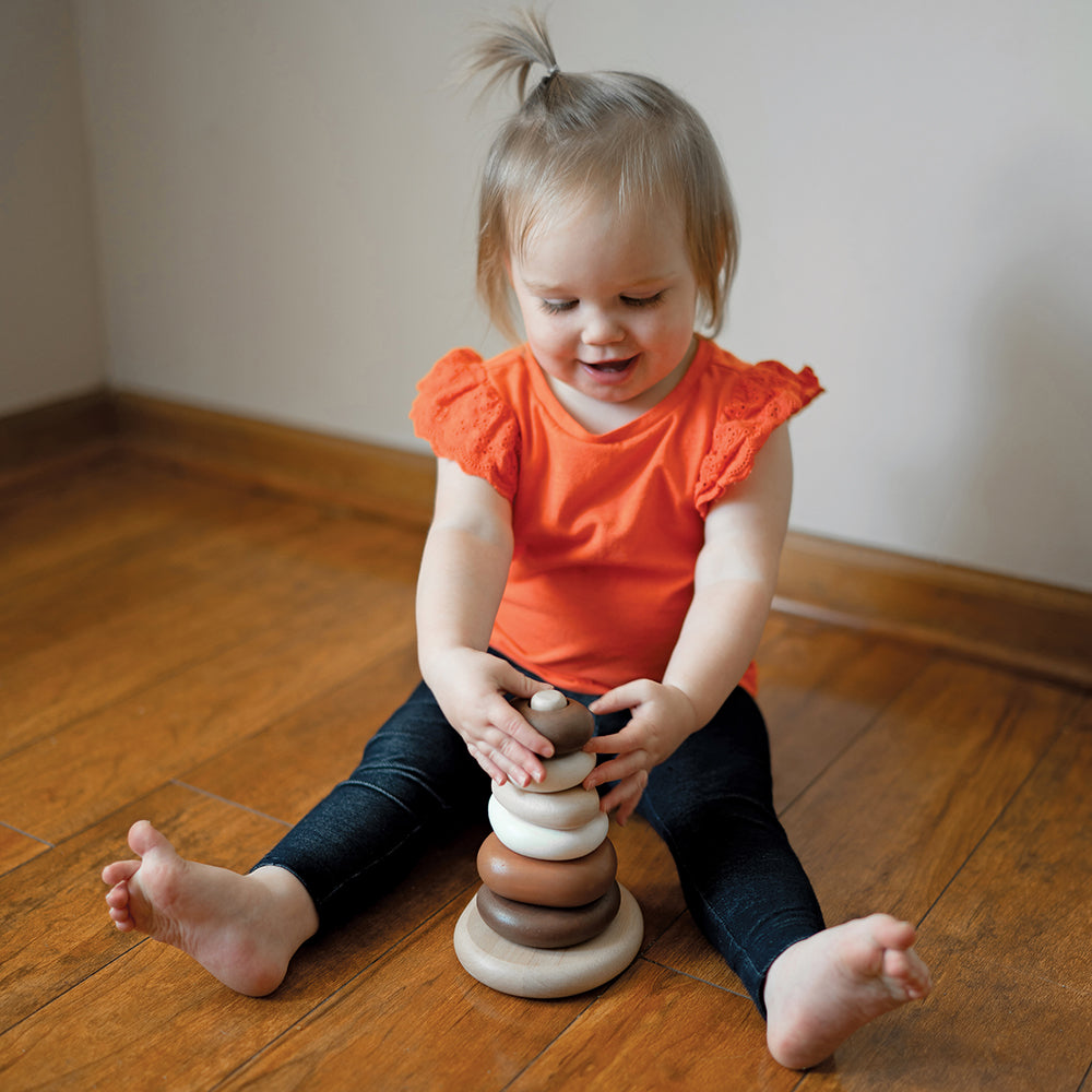 Toddler Interacting with Eco-Friendly Wooden Stacking Pebbles