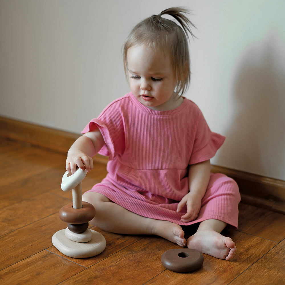 Toddler Using Eco-Friendly Wooden Stacking Pebbles