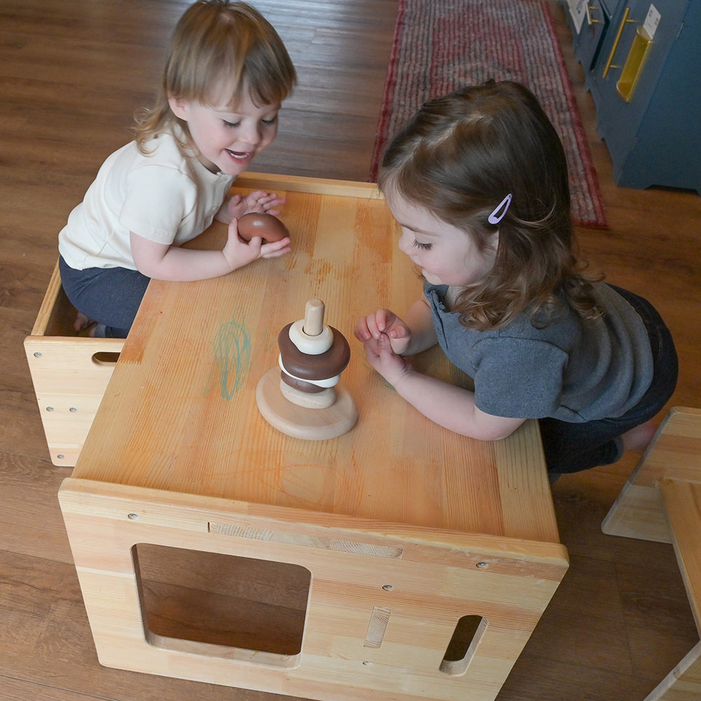 Two Toddlers Using Eco-Friendly Wooden Stacking Pebbles