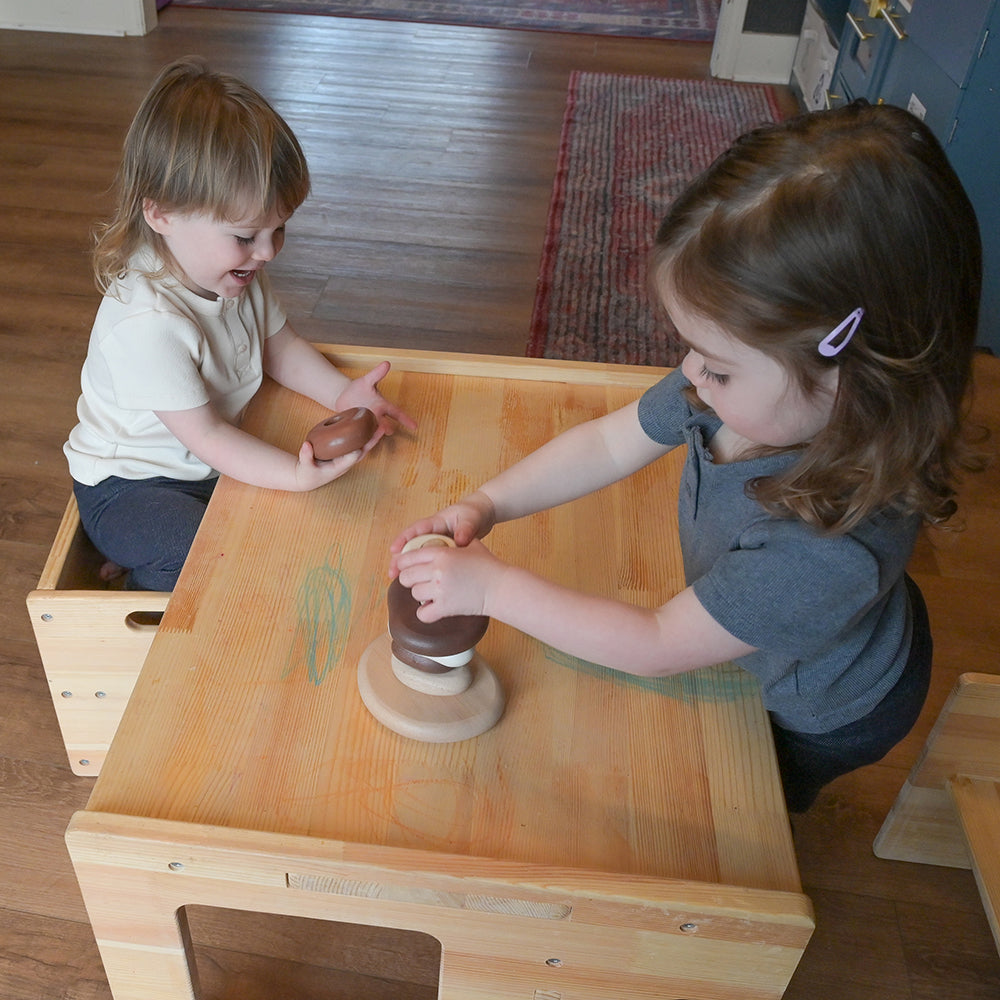 Two Toddlers Playing Together with Eco-Friendly Wooden Stacking Pebbles