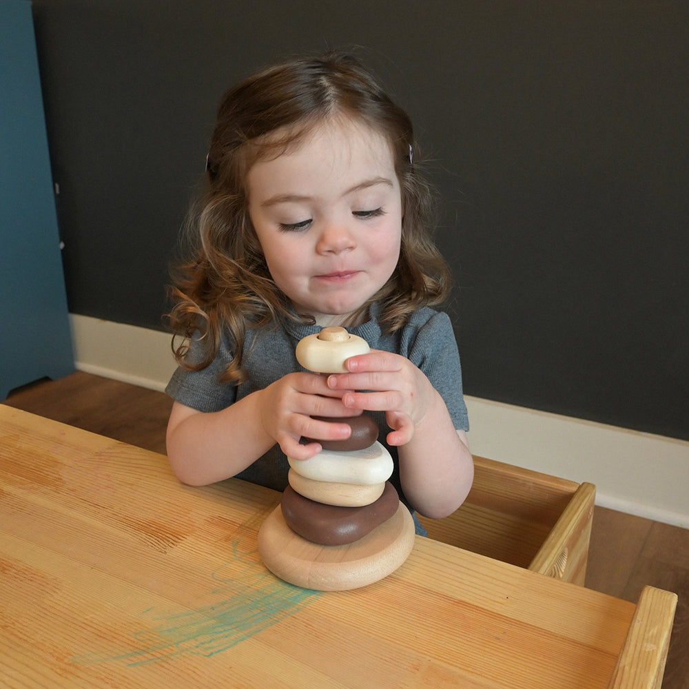 Toddler Having Fun with Eco-Friendly Wooden Stacking Pebbles