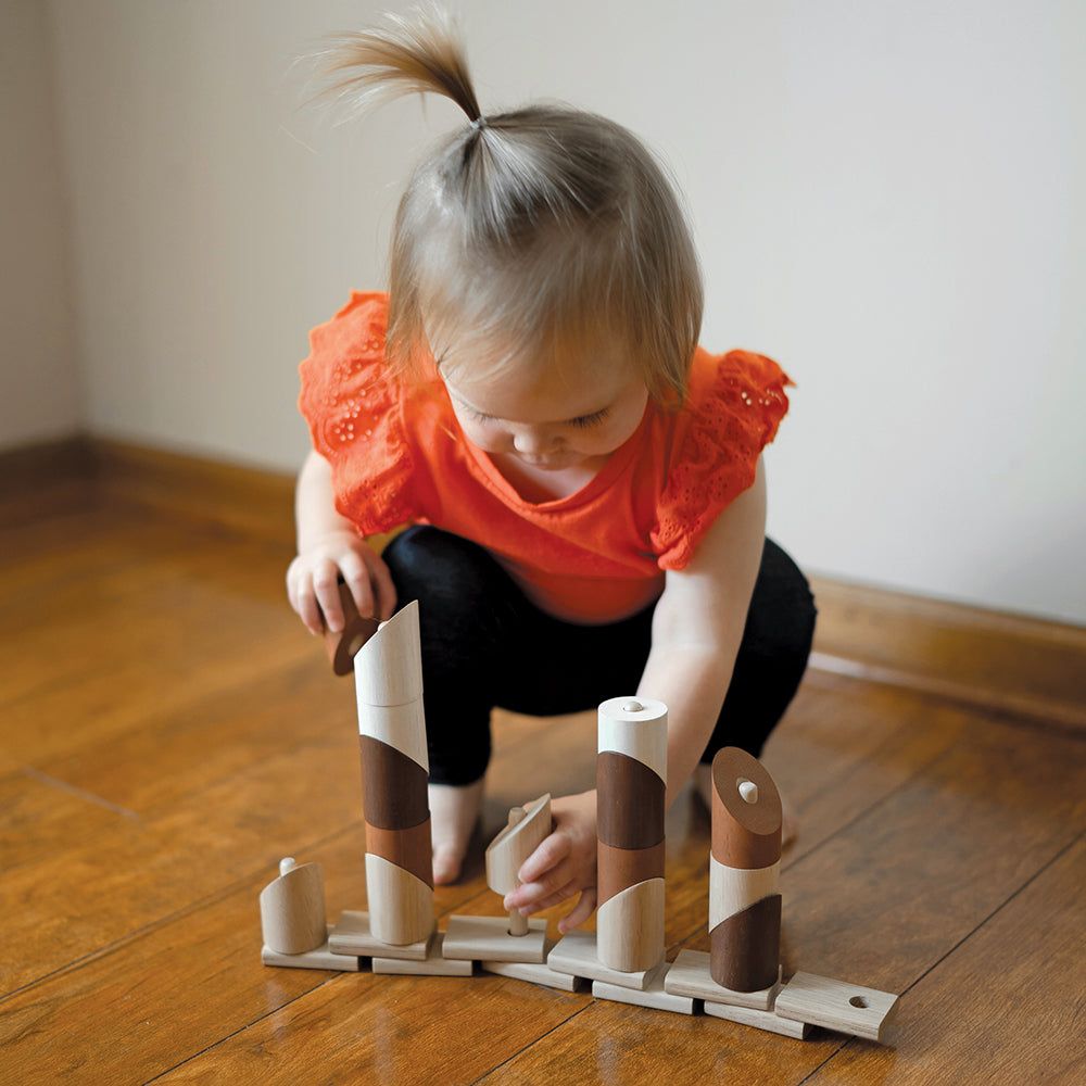 Toddler Using Natural Geo Stacker