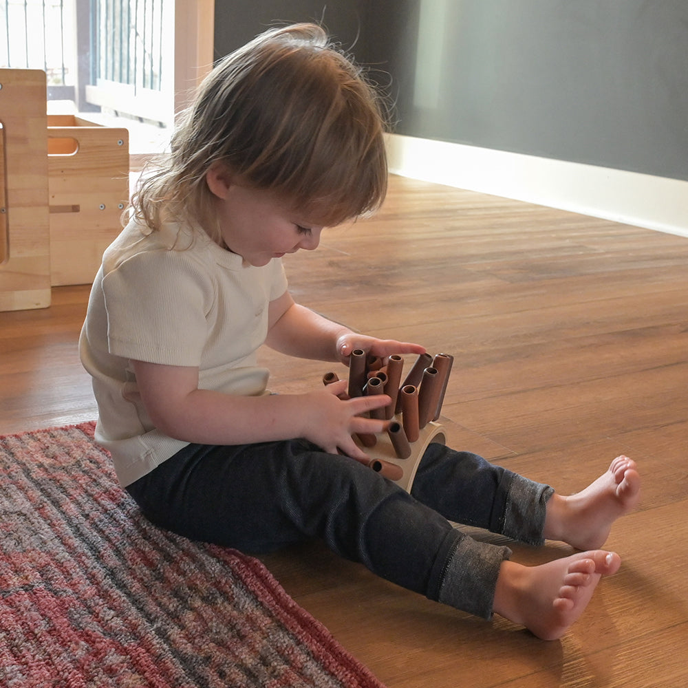 Kid Playing with Eco-Friendly Wooden Jiggle Sticks