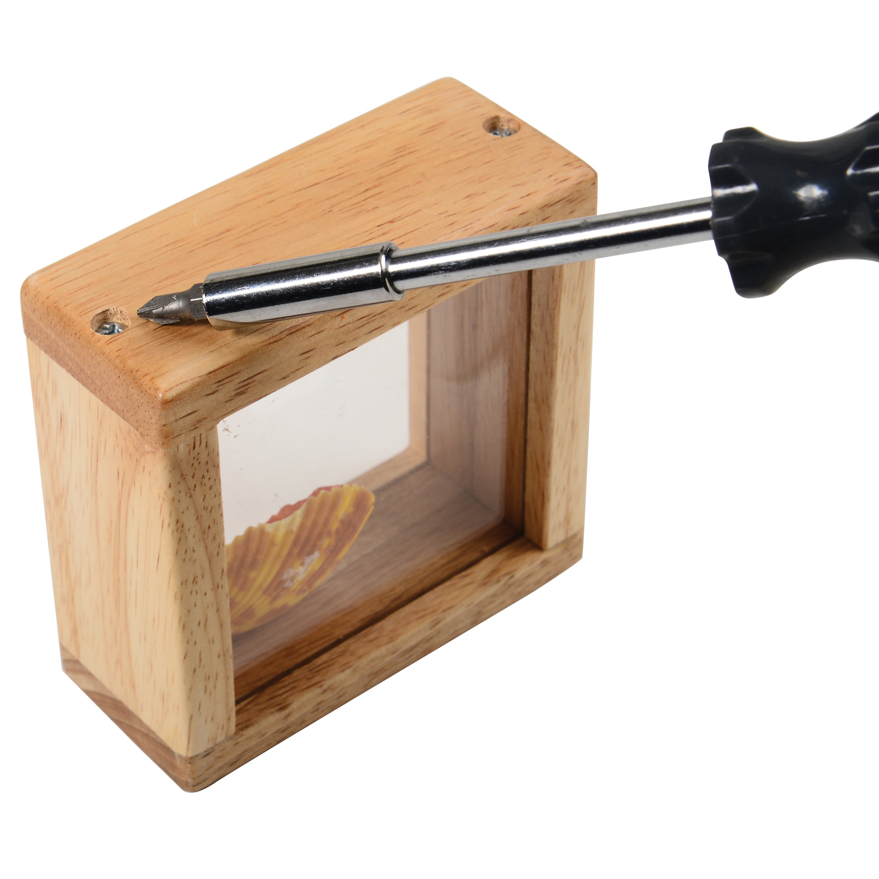 Wooden block with a transparent insert and screwdriver on a white background
