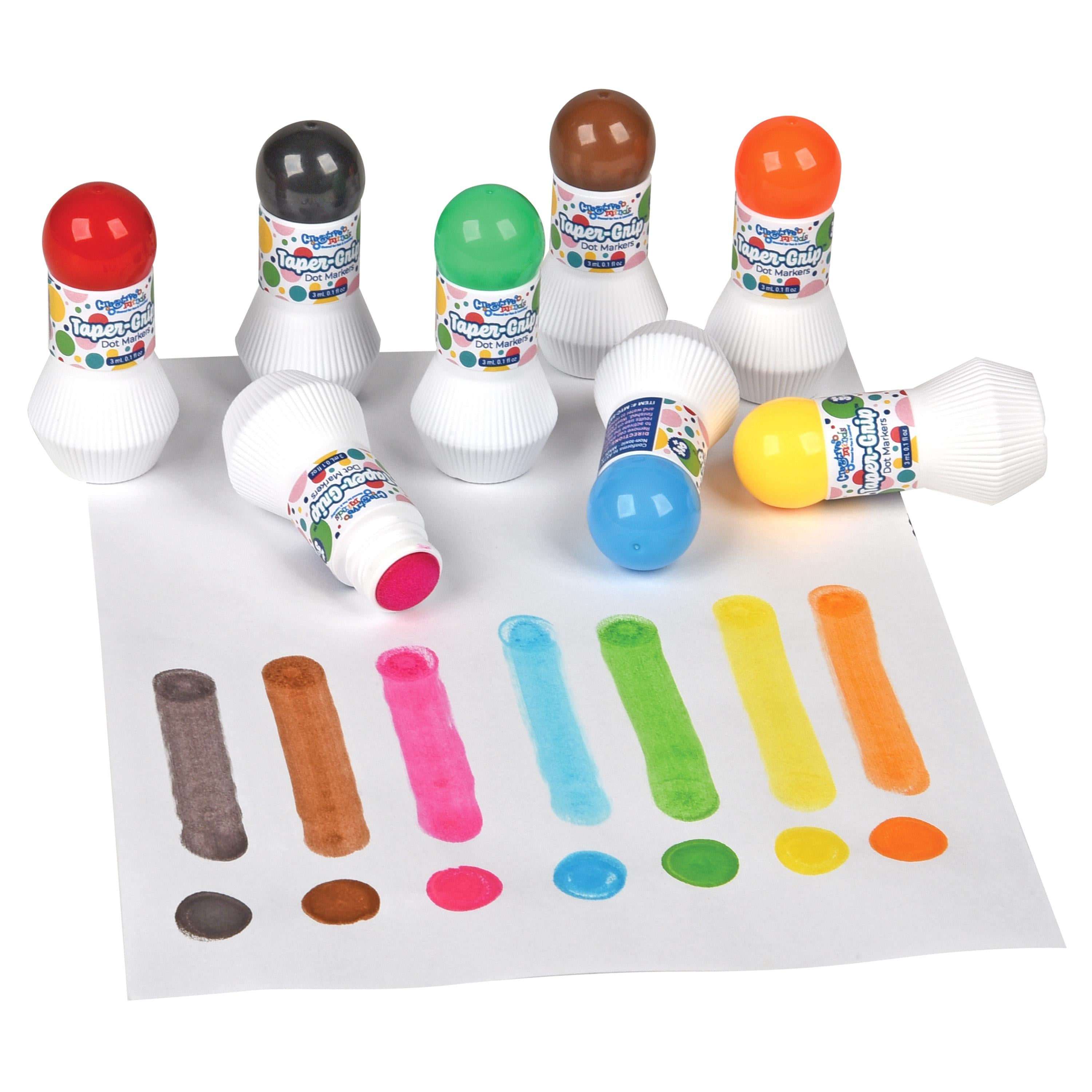 A set of colorful children's paint stamps with white handles and brightly colored round tops, arranged on a white sheet of paper that shows the resulting painted marks. The stamps include red, black, green, brown, orange, blue, yellow, and pink tops.