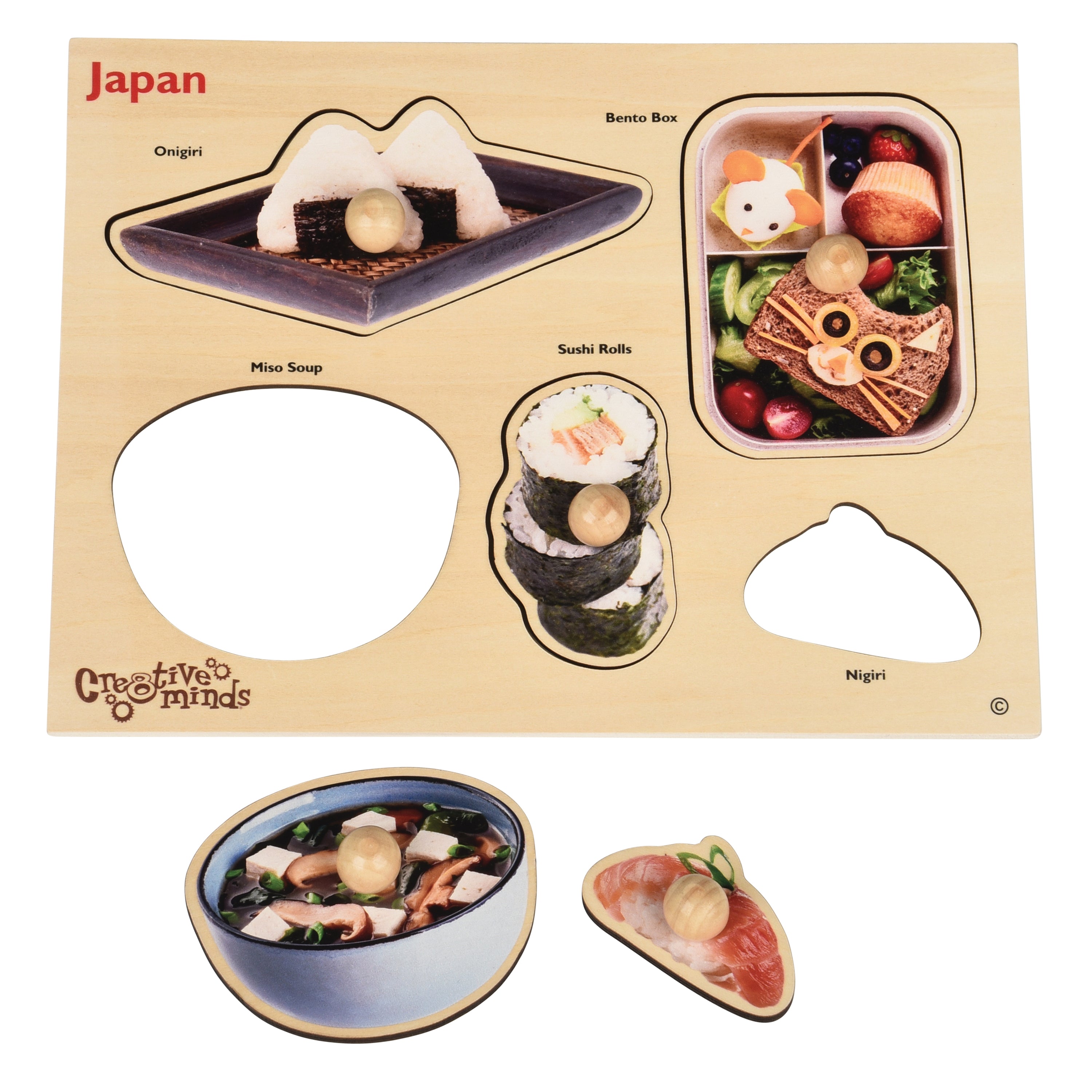 Educational toy set with cutouts of Japanese food items on a beige background