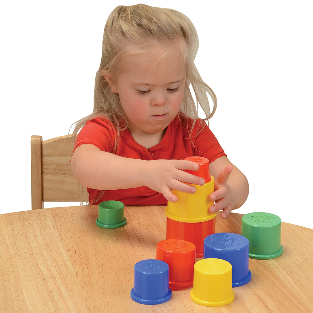 Toddler Engaging with Nesting Cups on Tabletop