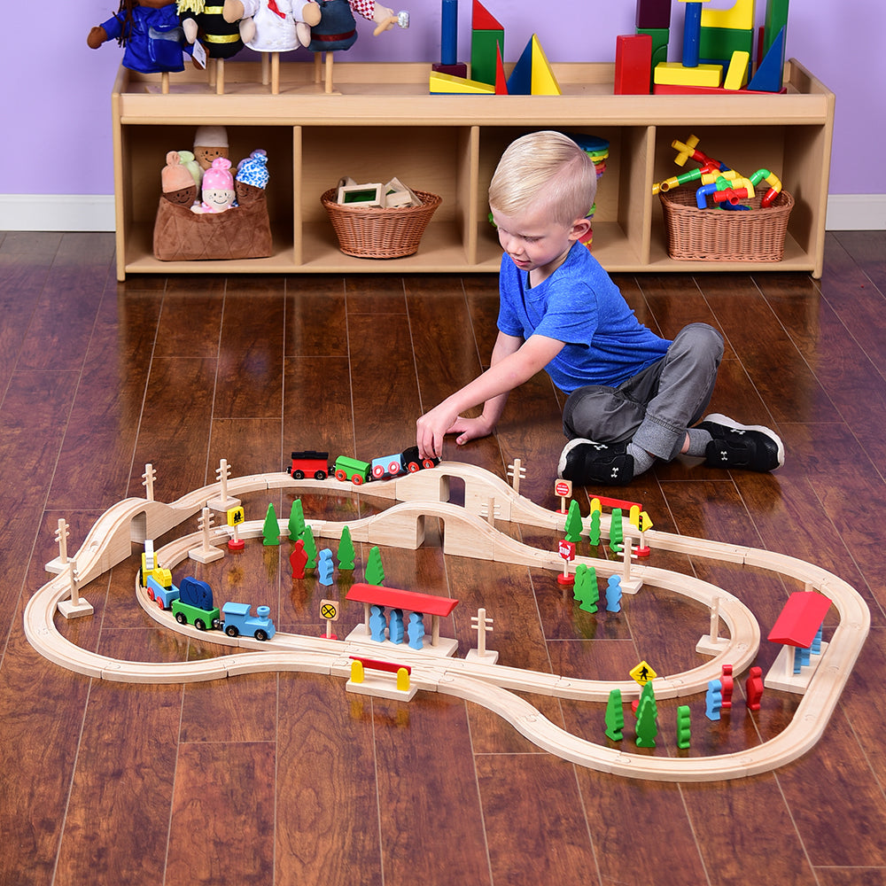 Kid Using 55-Piece Magnetic Wooden Train Set with Tracks, Bridges & Accessories in the Classroom