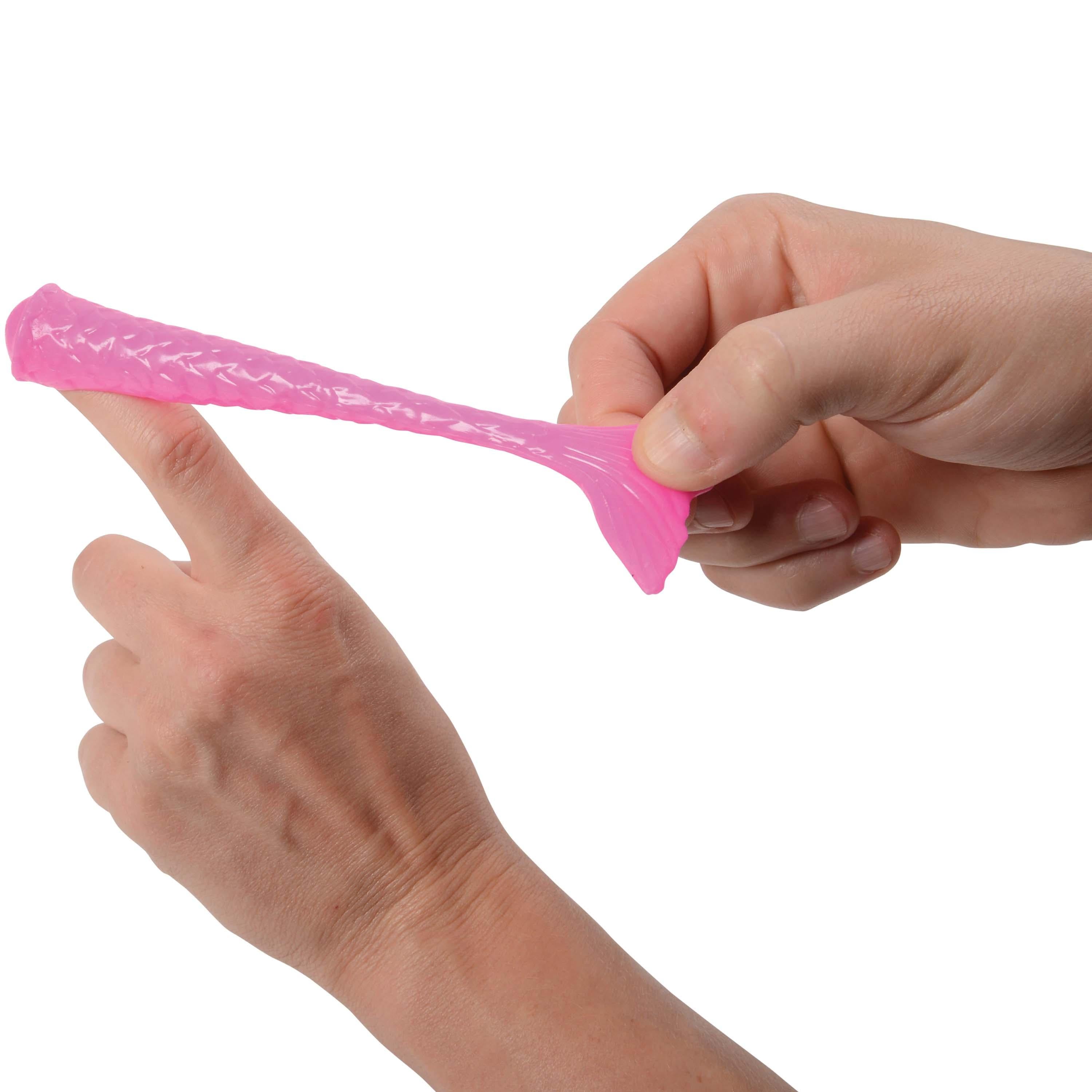 A pair of hands stretching a translucent pink silicone sleeve, demonstrating its elasticity, against a plain white background.