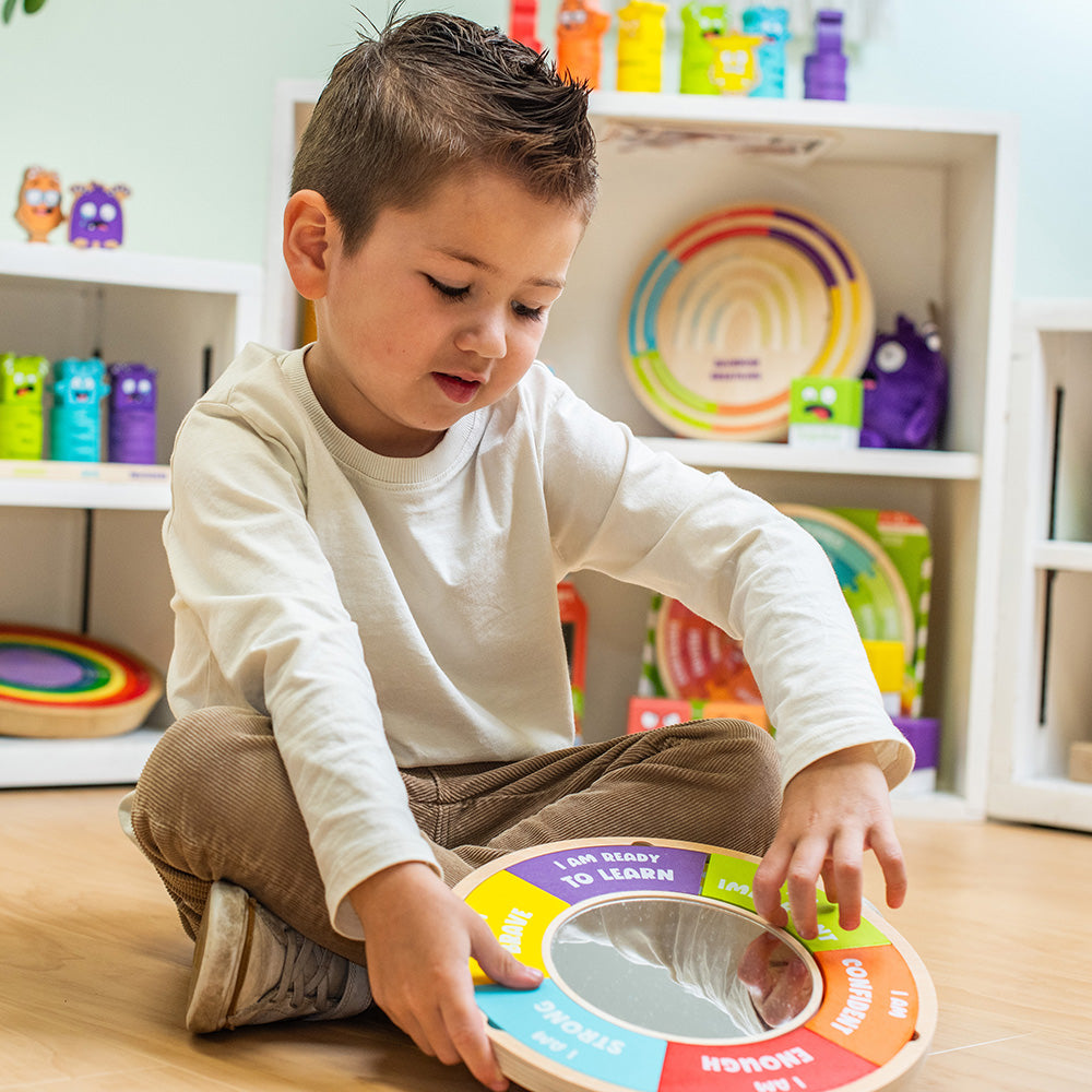 Child playing with a colorful educational toy in a classroom setting
