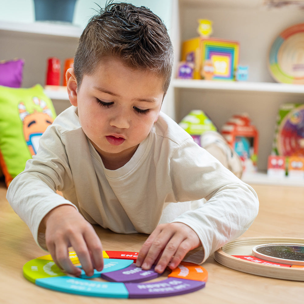 Child playing with a colorful educational toy in a classroom setting