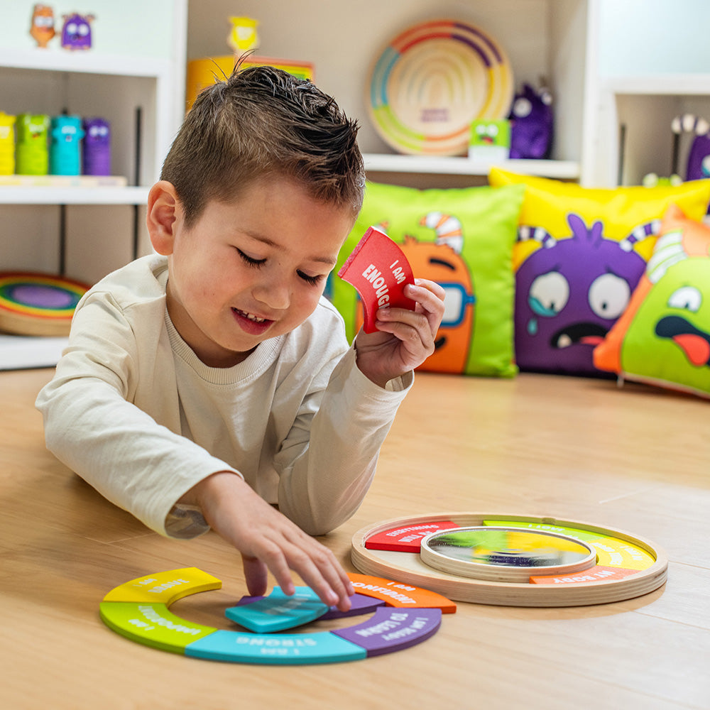Child playing with colorful educational toys on a wooden floor