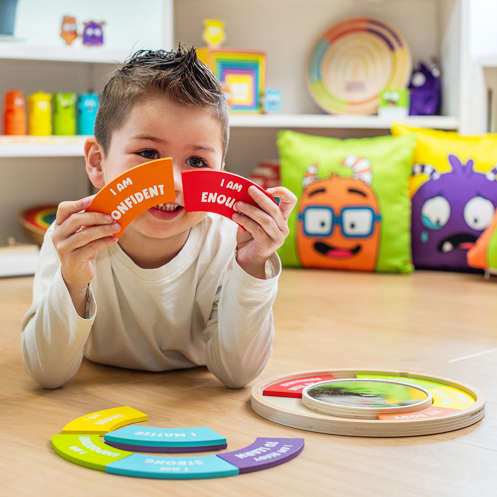 Child playing with colorful educational toys on a wooden floor