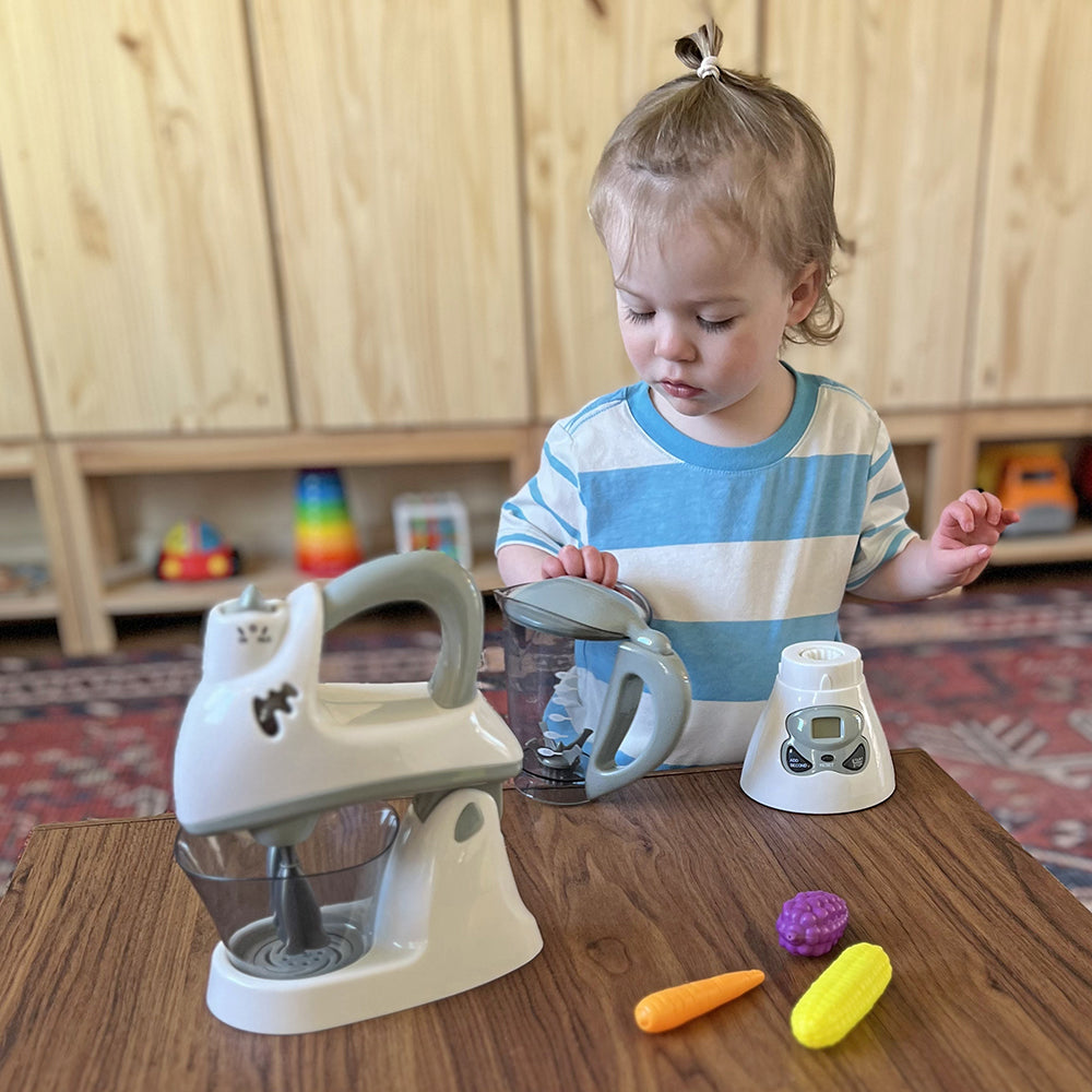 Toddler Playing With Toy Blender