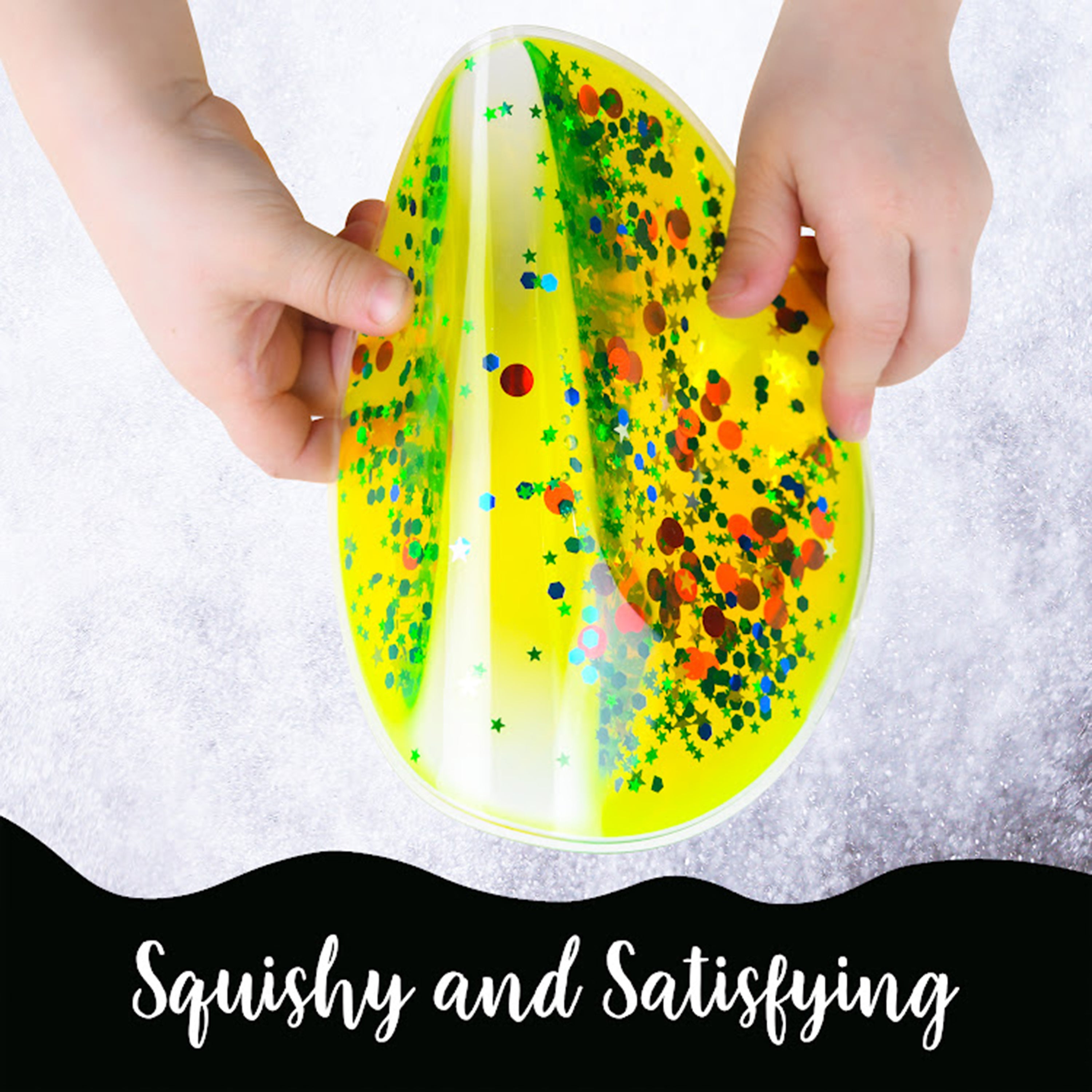 Yellow and green slimes with colorful sprinkles held by a child's hands on a white background.