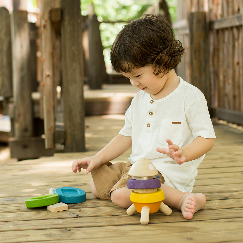 Kid Playing with Stacking Rocket Toy