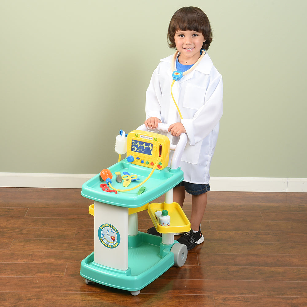 Kid with Lab Coat Pushing Pretend Play Medical Cart with Accessories in the Classroom