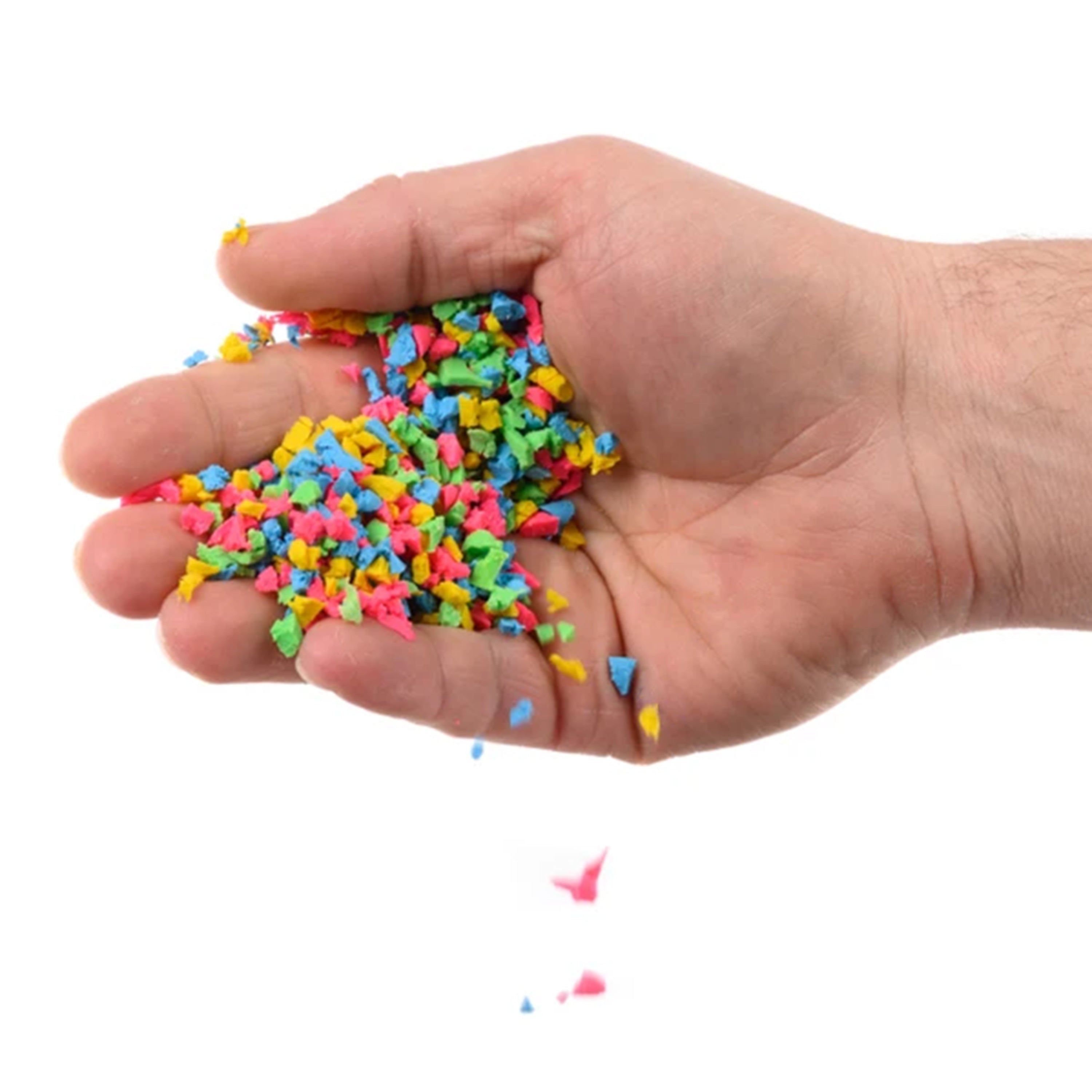 Hand holding colorful small plastic shapes on a white background