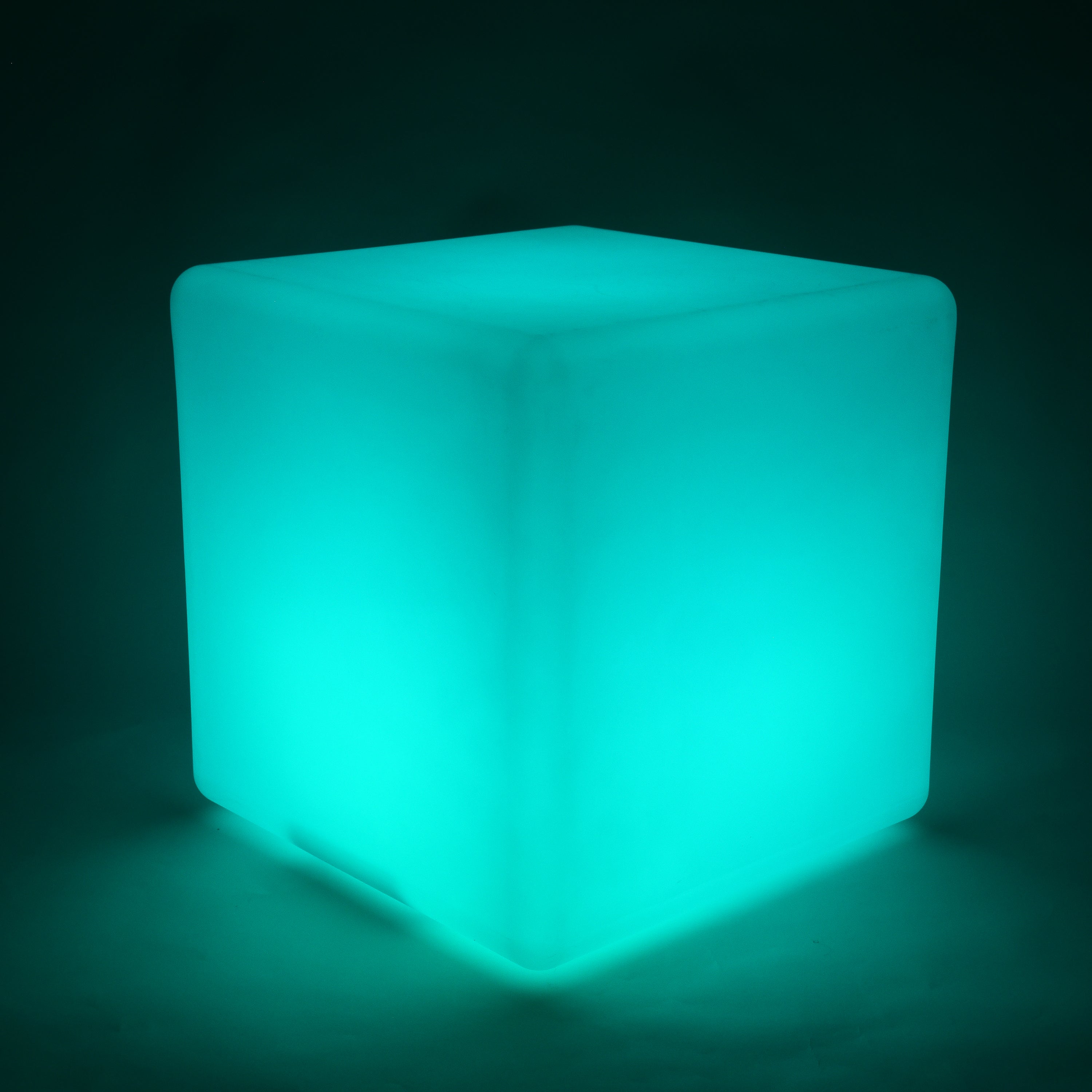 Glowing teal cube on a dark background