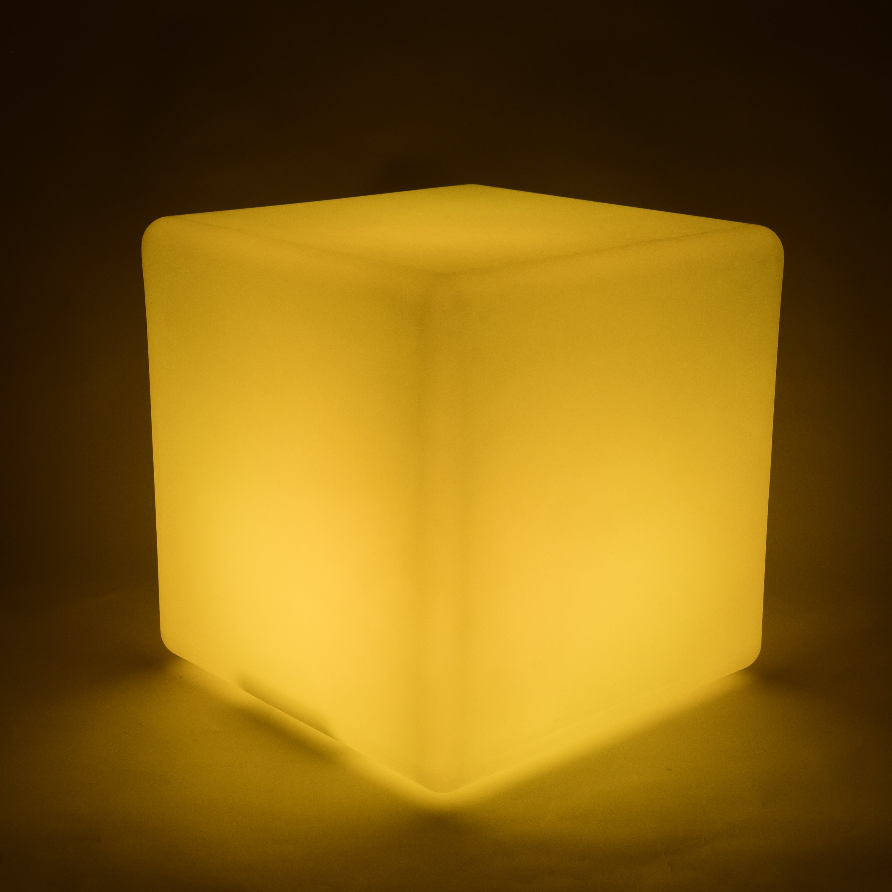 Yellow cube-shaped light on a dark background