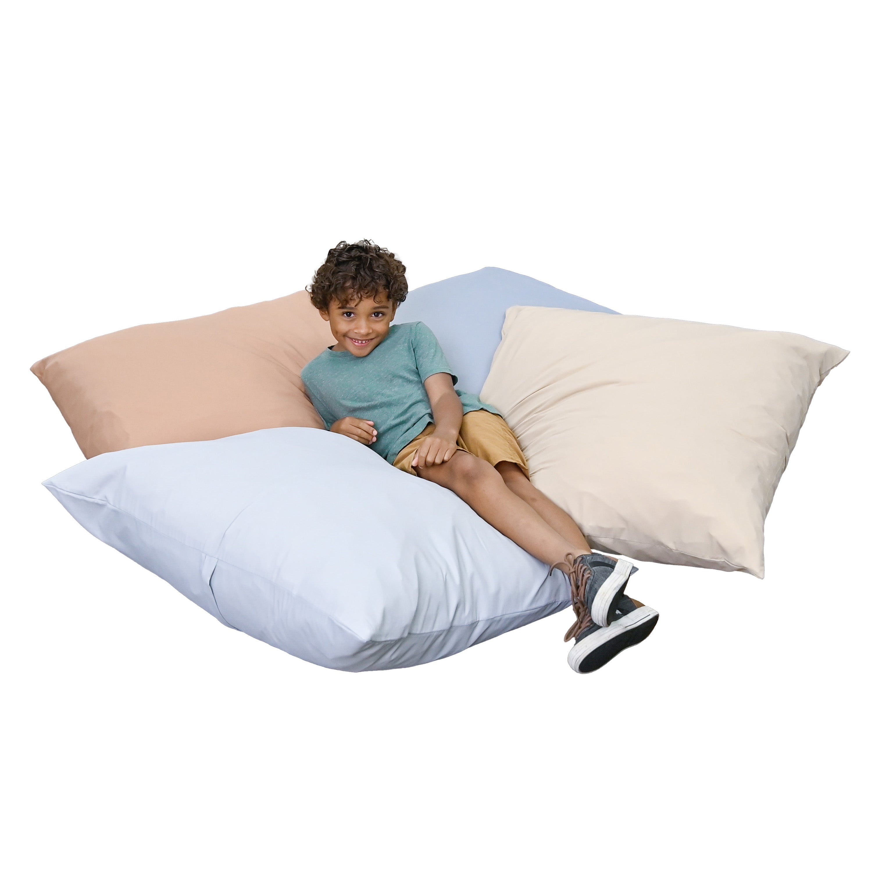 Child sitting on multiple pillows in various colors.