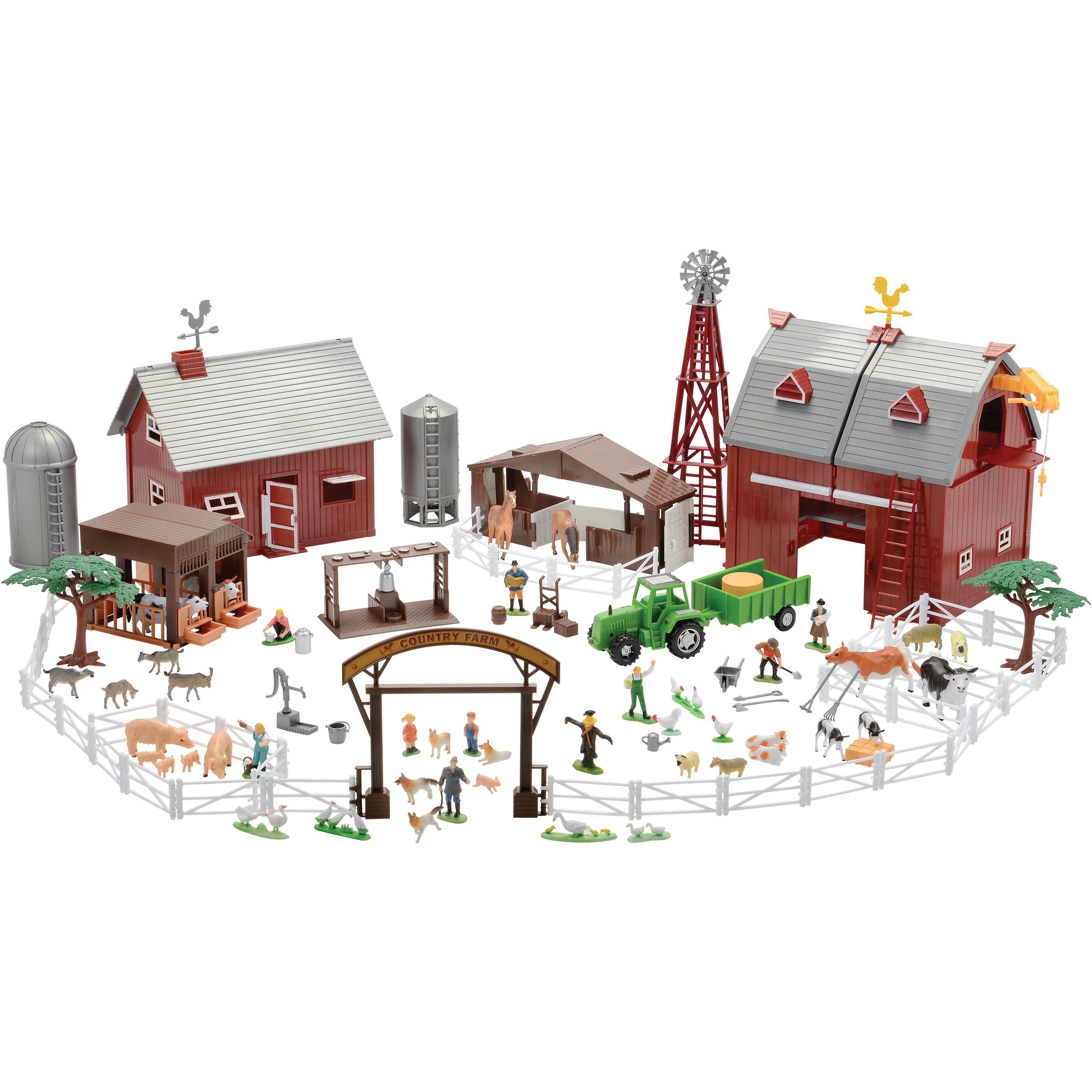 Toy farm set with barn, silos, animals, and vehicles on a white background