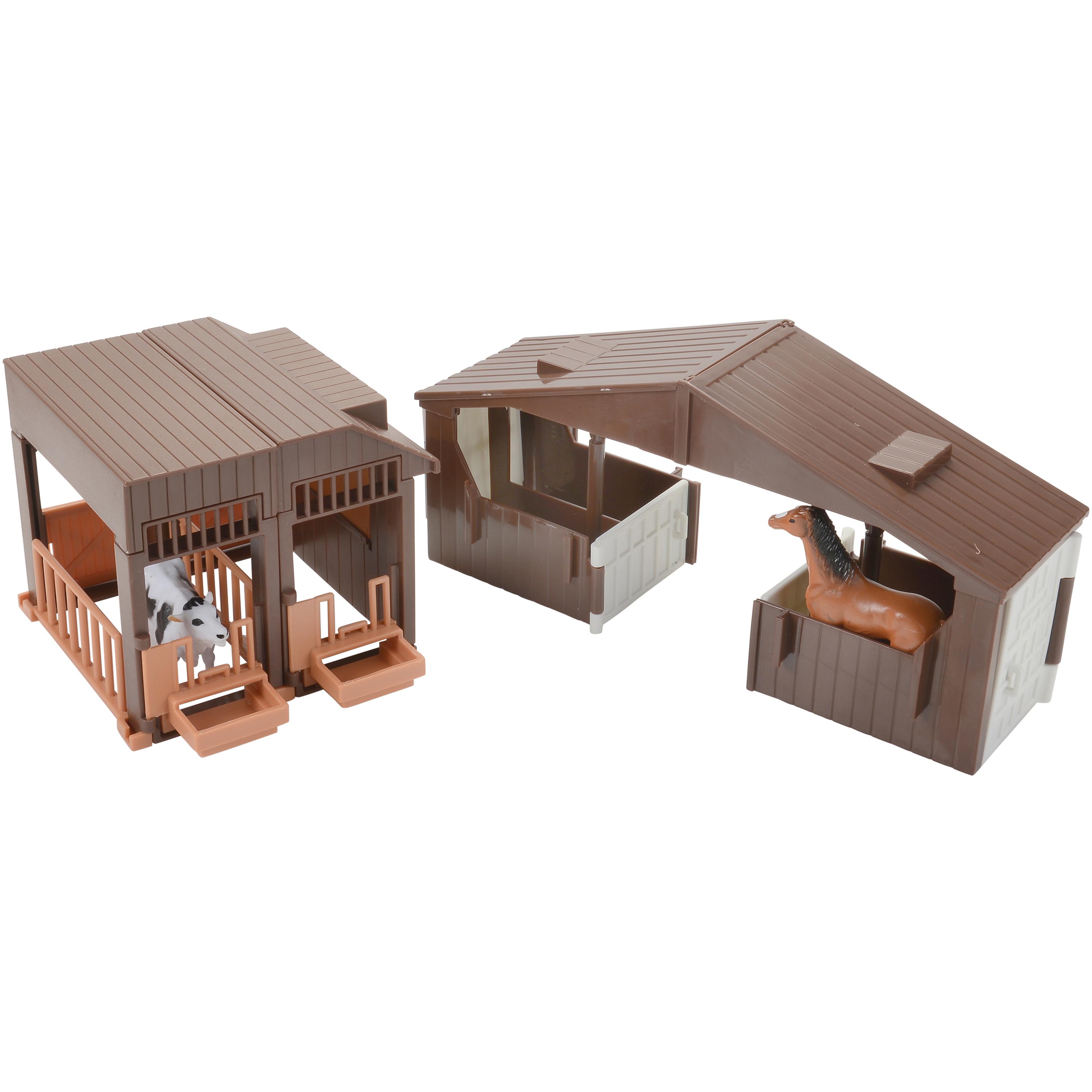 Model horse stables with horses on a white background